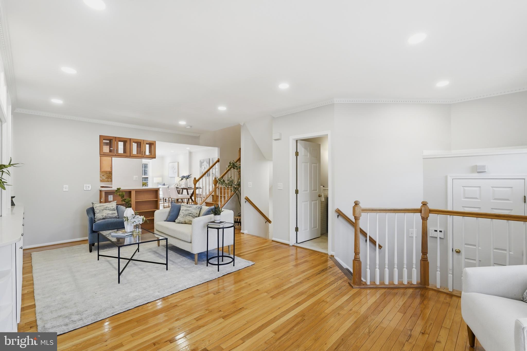 1472 Park Garden Lane Reston, VA 20194 - Photo 9 of 64 a view of a livingroom with furniture and wooden floor