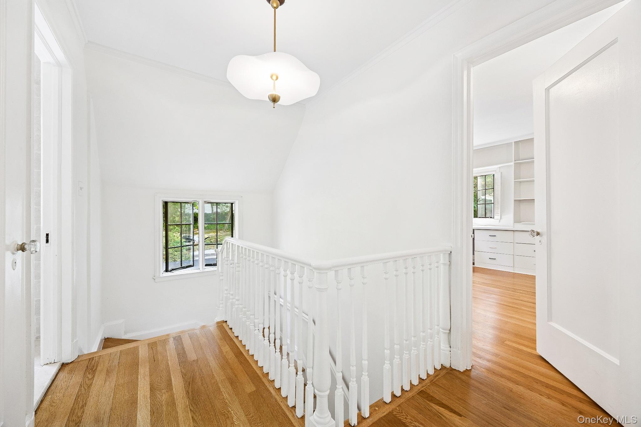 10 River Road Scarsdale, NY 10583 - Photo 12 of 20 Hallway featuring an upstairs landing, crown molding, and wood finished floors