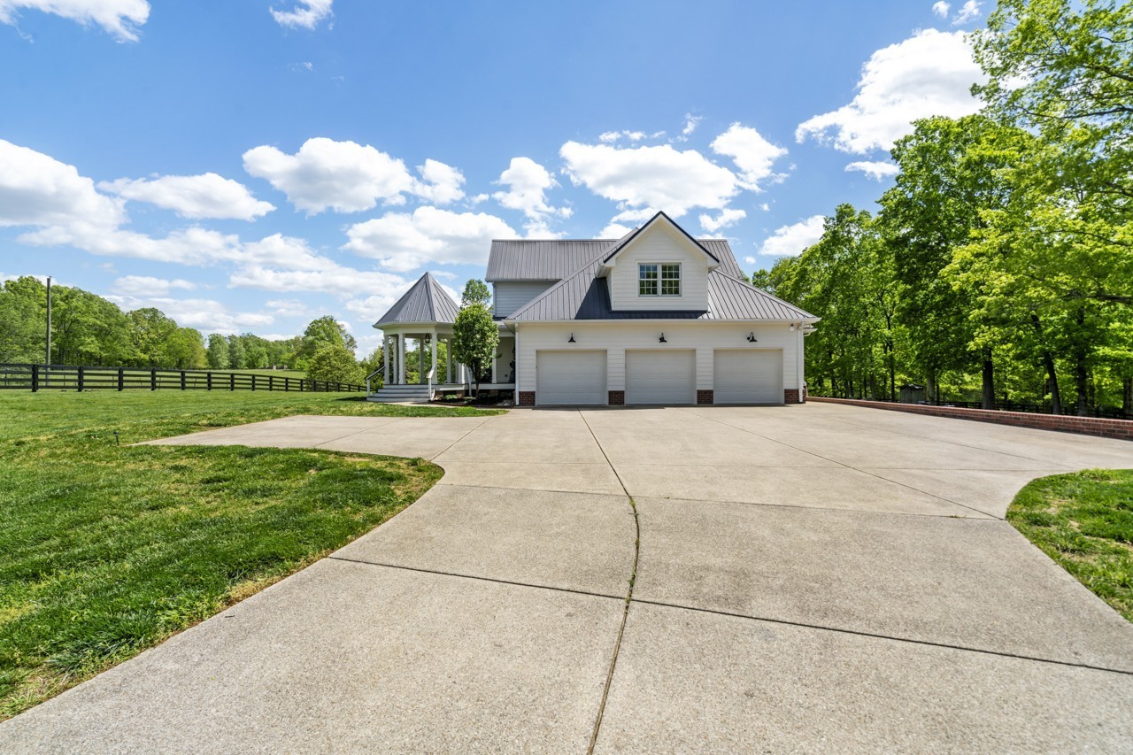 5807 Bending Chestnut Road Franklin, TN 37064 - Photo 3 of 70 a front view of a house with a yard