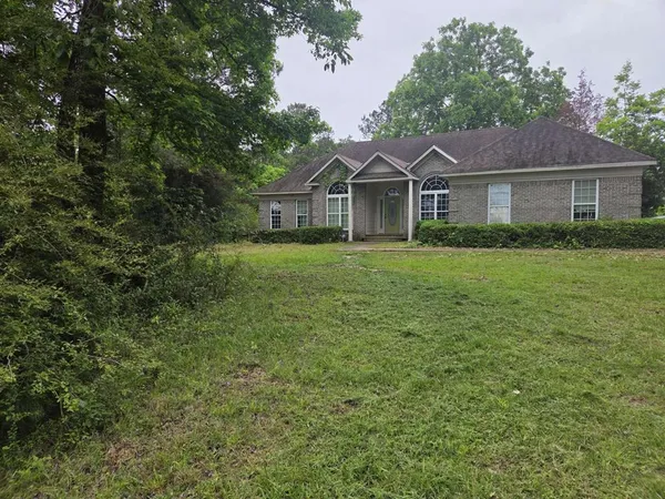 a front of a house with a yard