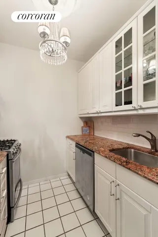 a kitchen with a cabinets and window