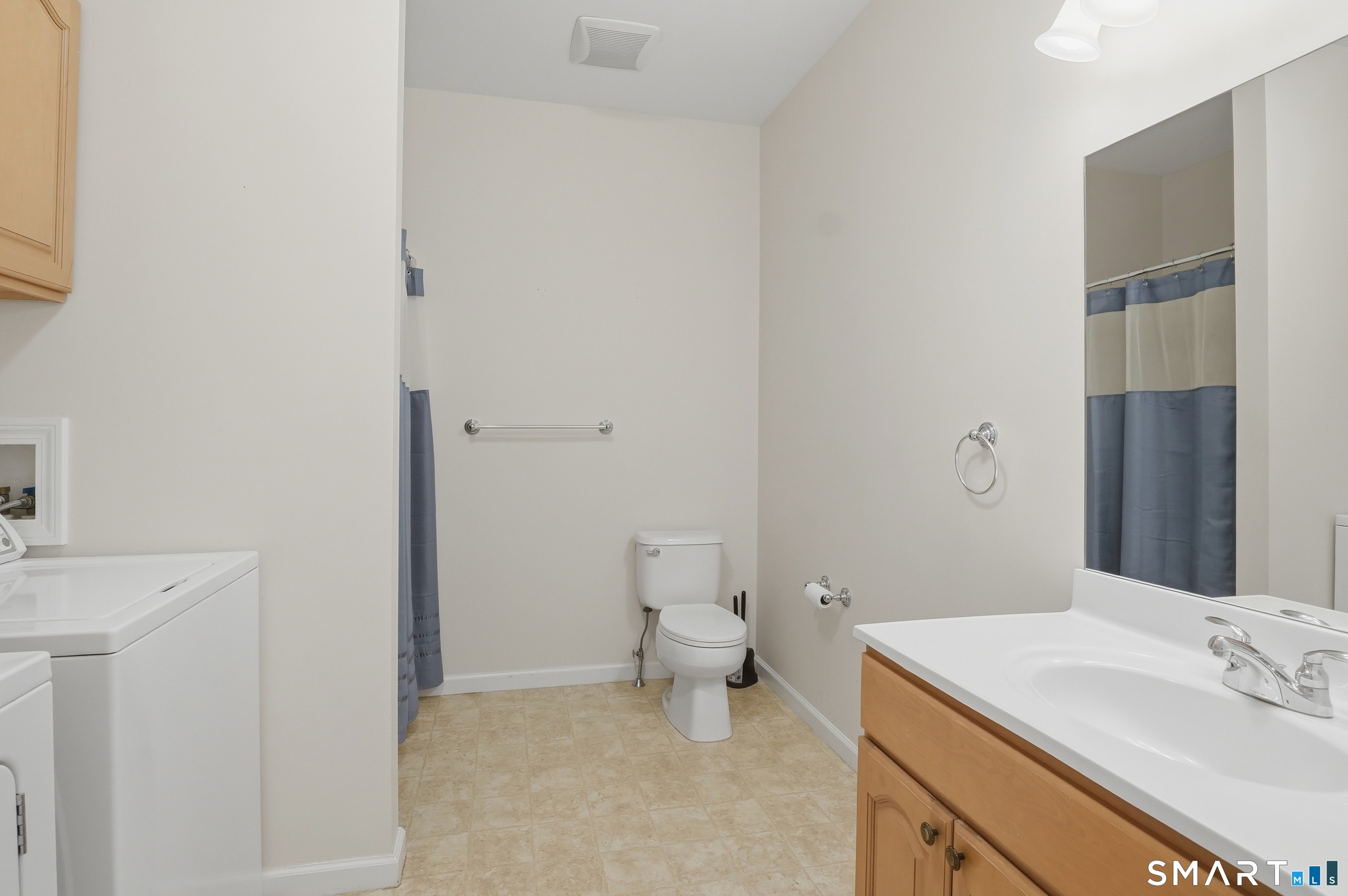 2 Park Avenue, Unit 3 Wolcott, CT 06716 - Photo 12 of 18 a bathroom with a sink toilet and a mirror