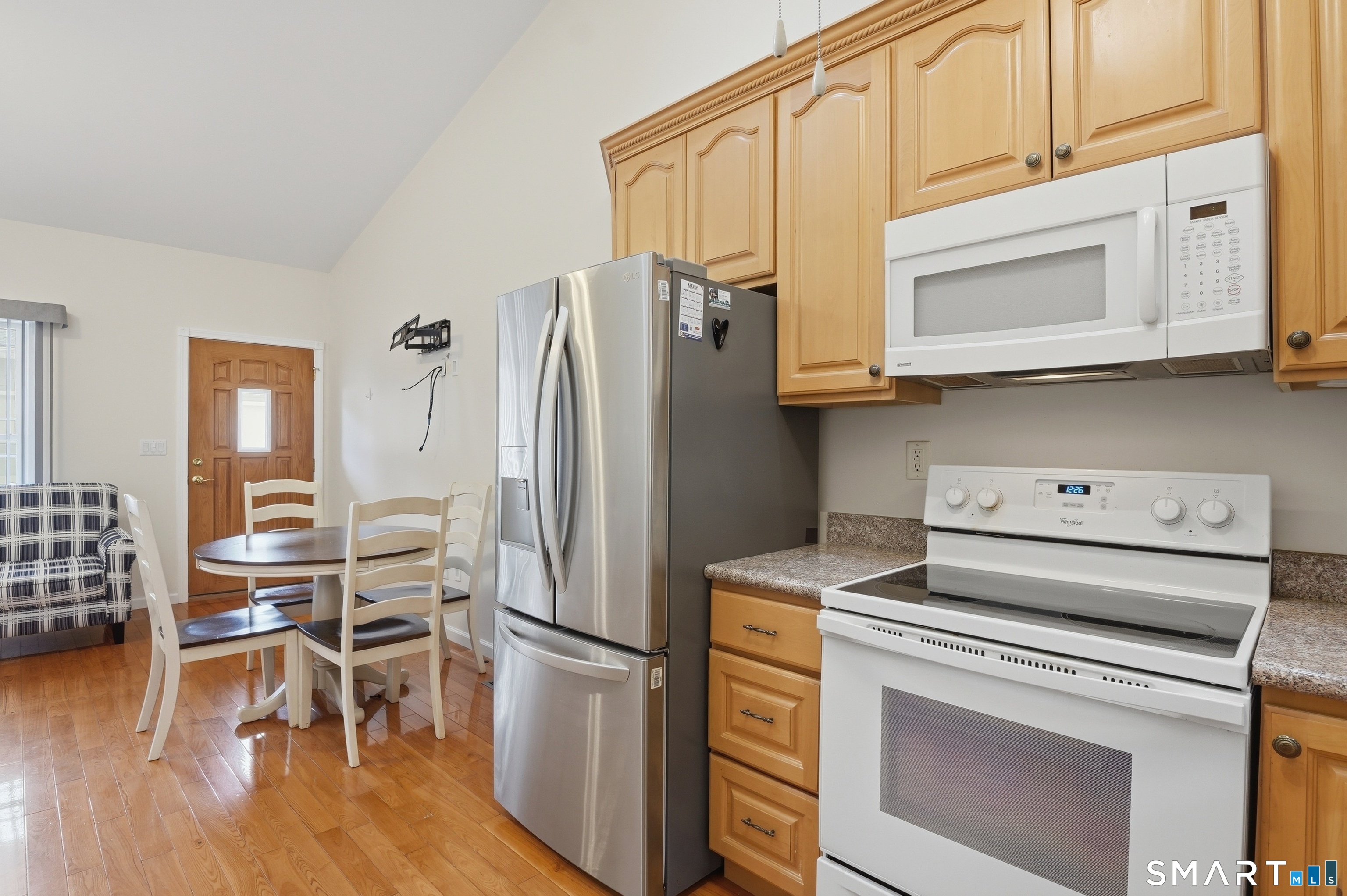 2 Park Avenue, Unit 3 Wolcott, CT 06716 - Photo 8 of 18 a kitchen with stainless steel appliances white cabinets and wooden floor