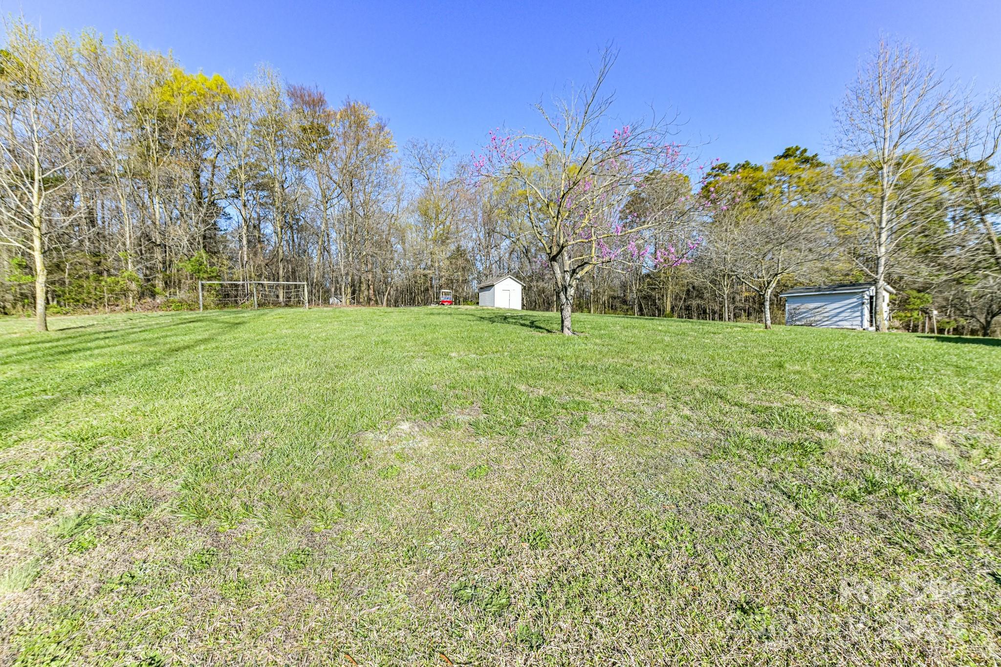 717 Clontz Long Road Monroe, NC 28110 - Photo 12 of 35 a view of a big yard with a house