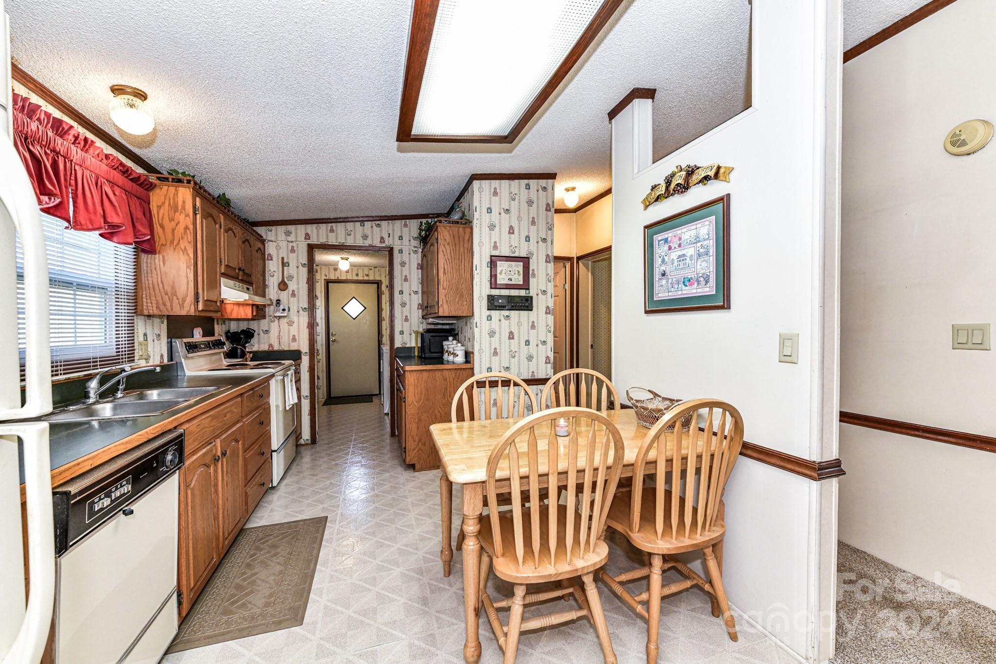 717 Clontz Long Road Monroe, NC 28110 - Photo 20 of 35 a dining room with furniture and entryway