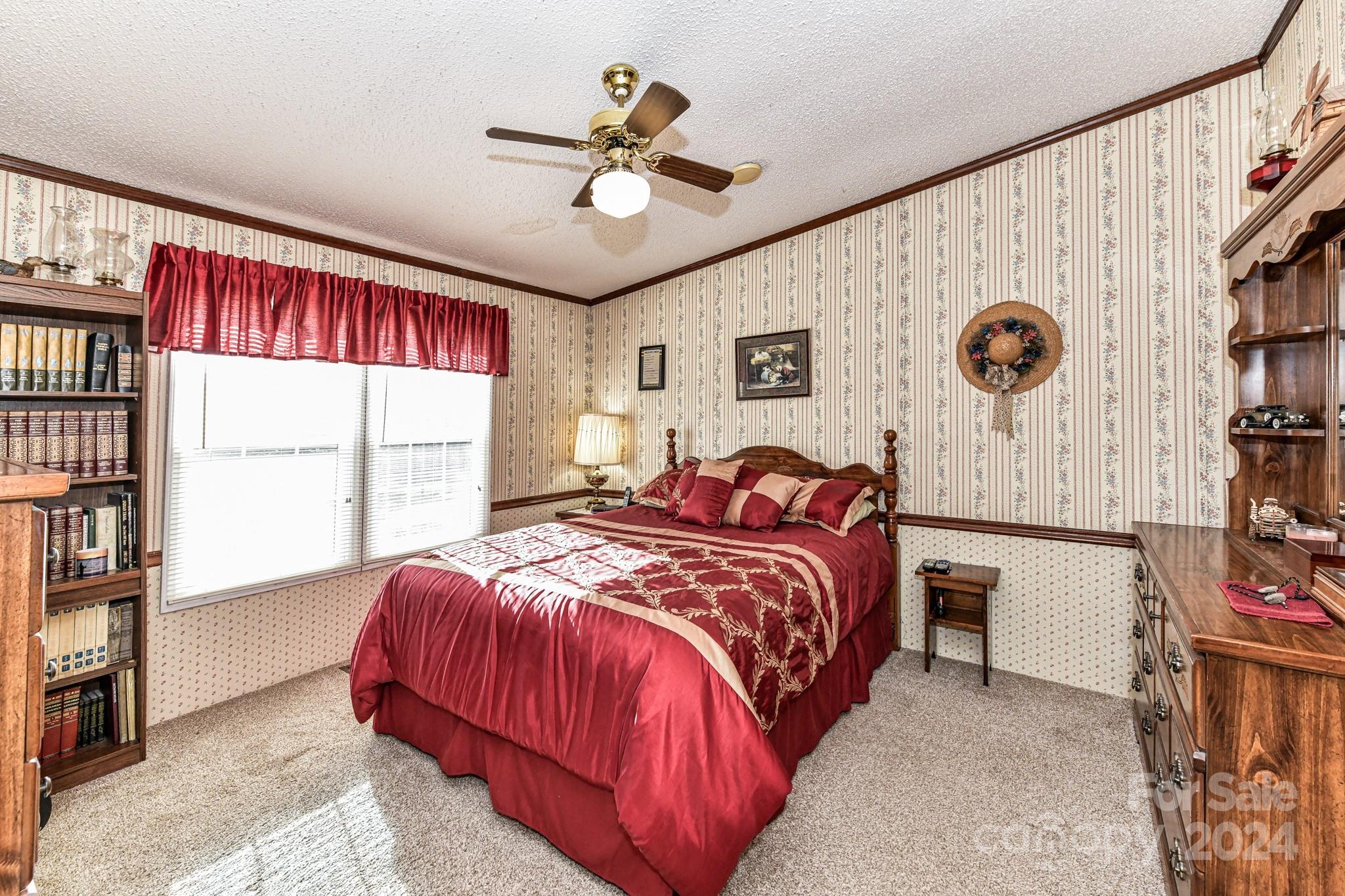 717 Clontz Long Road Monroe, NC 28110 - Photo 21 of 35 a bedroom with a bed and a window