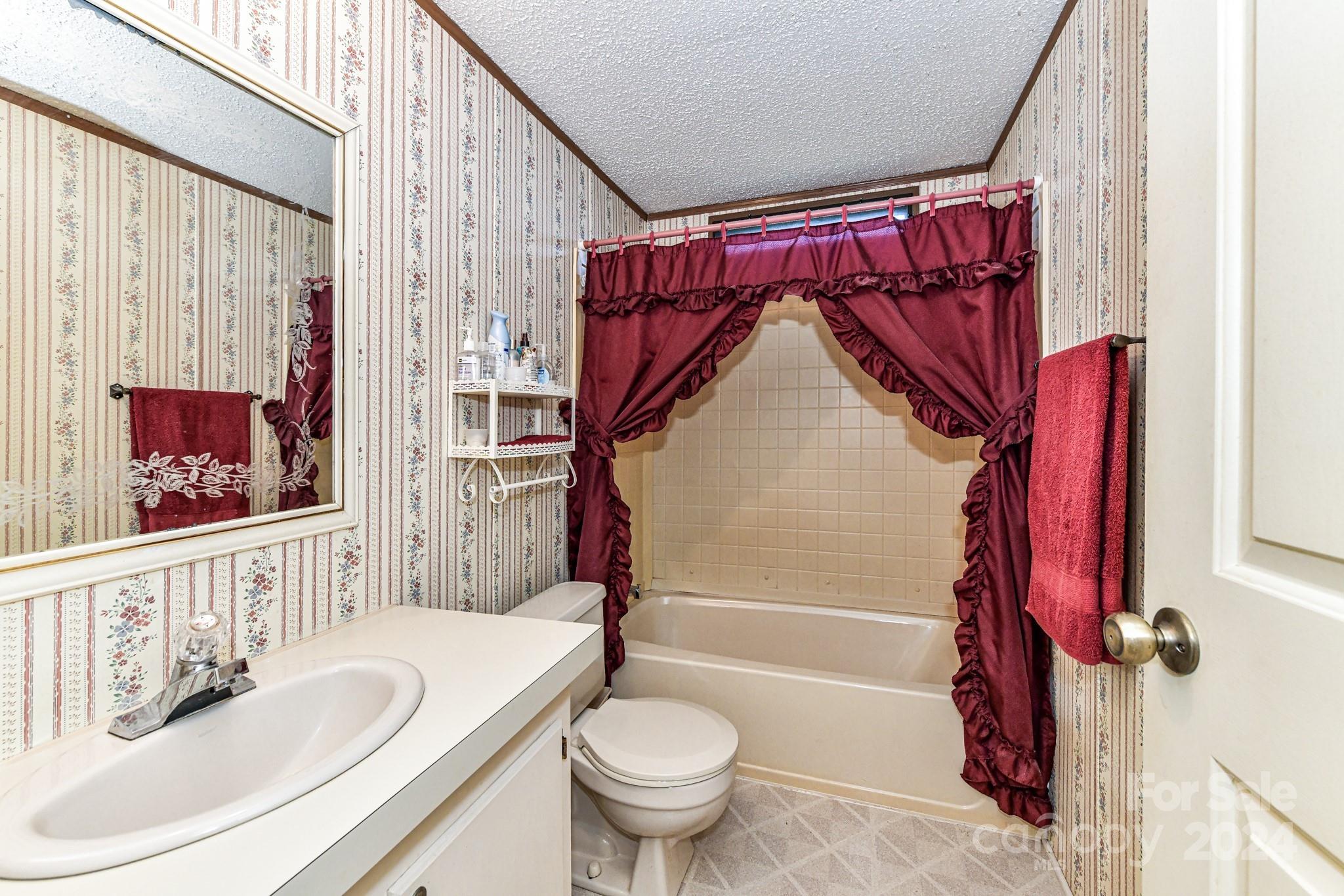 717 Clontz Long Road Monroe, NC 28110 - Photo 25 of 35 a bathroom with a granite countertop bathtub sink vanity mirror and toilet