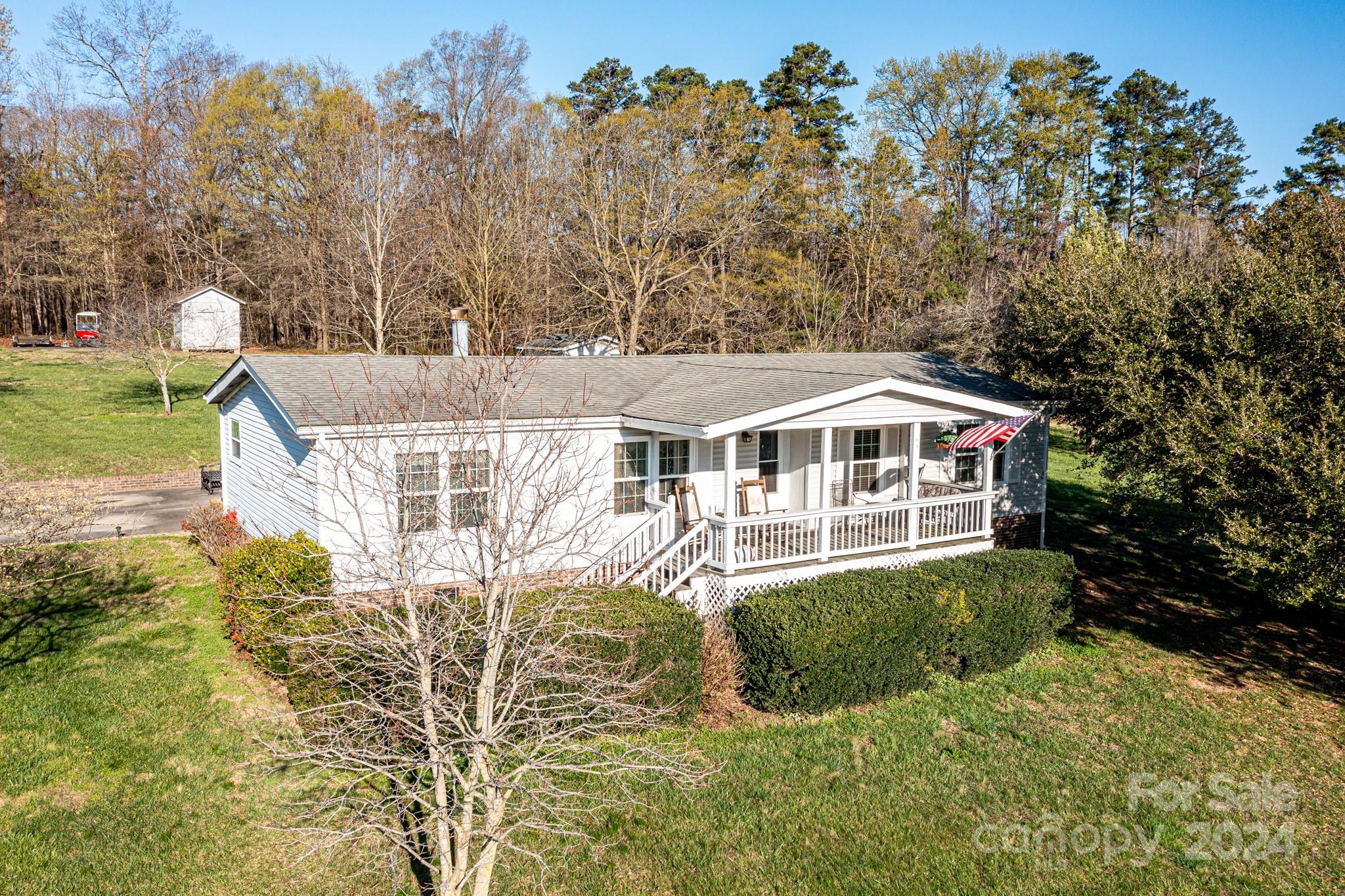 717 Clontz Long Road Monroe, NC 28110 - Photo 29 of 35 a front view of a house with a yard