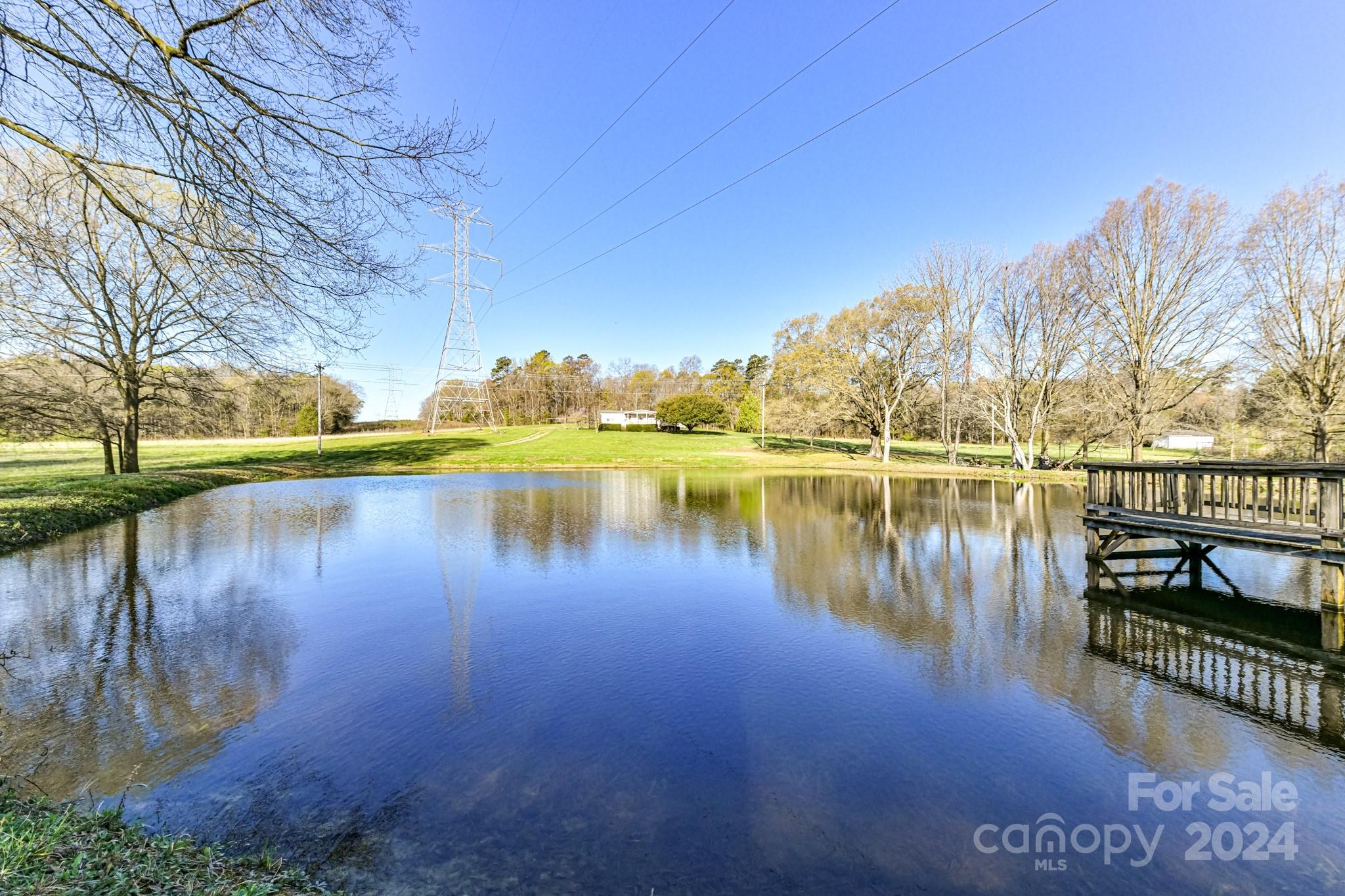717 Clontz Long Road Monroe, NC 28110 - Photo 35 of 35 a view of a lake with houses in the back
