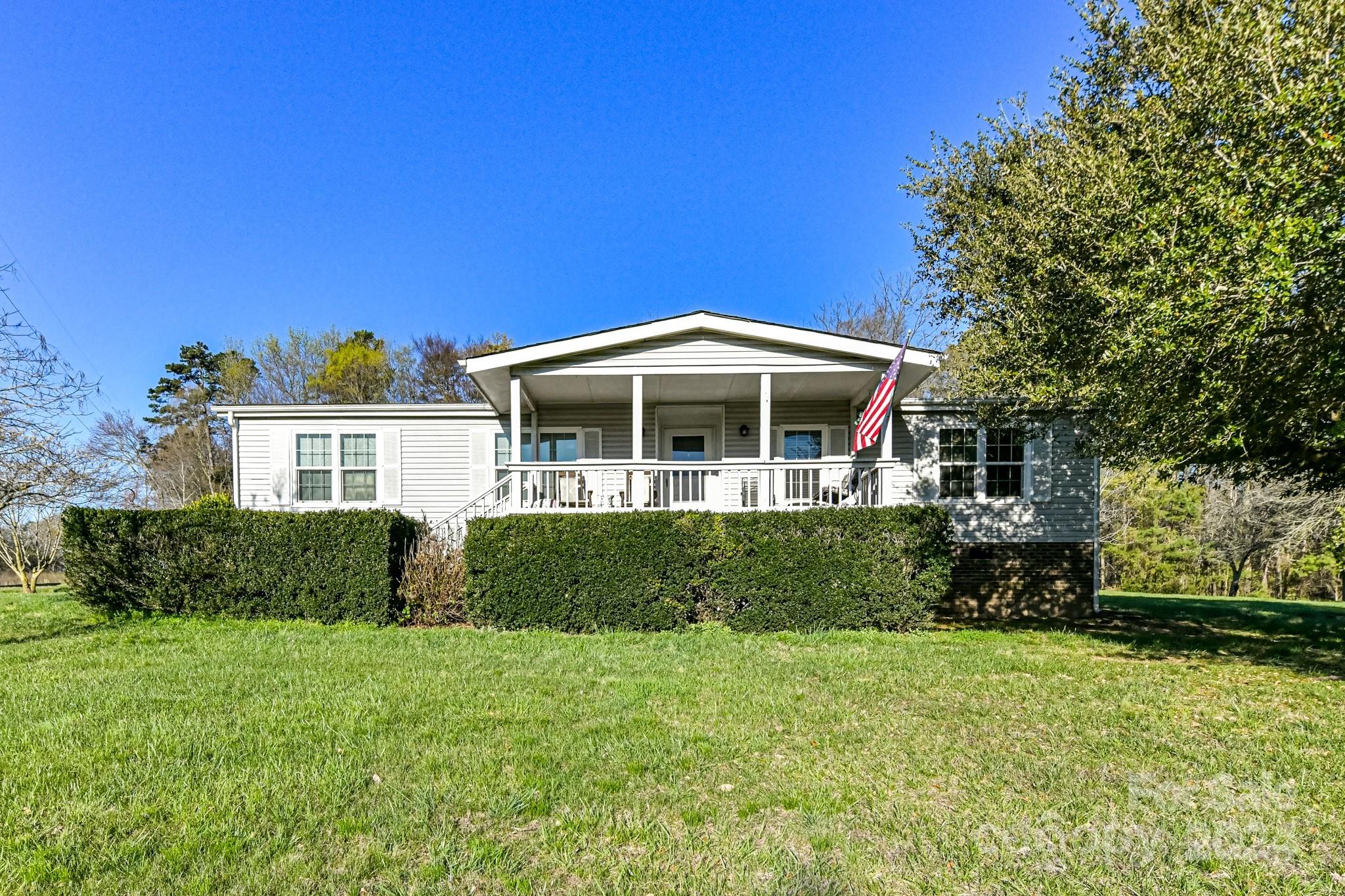 717 Clontz Long Road Monroe, NC 28110 - Photo 6 of 35 a front view of a house with a yard