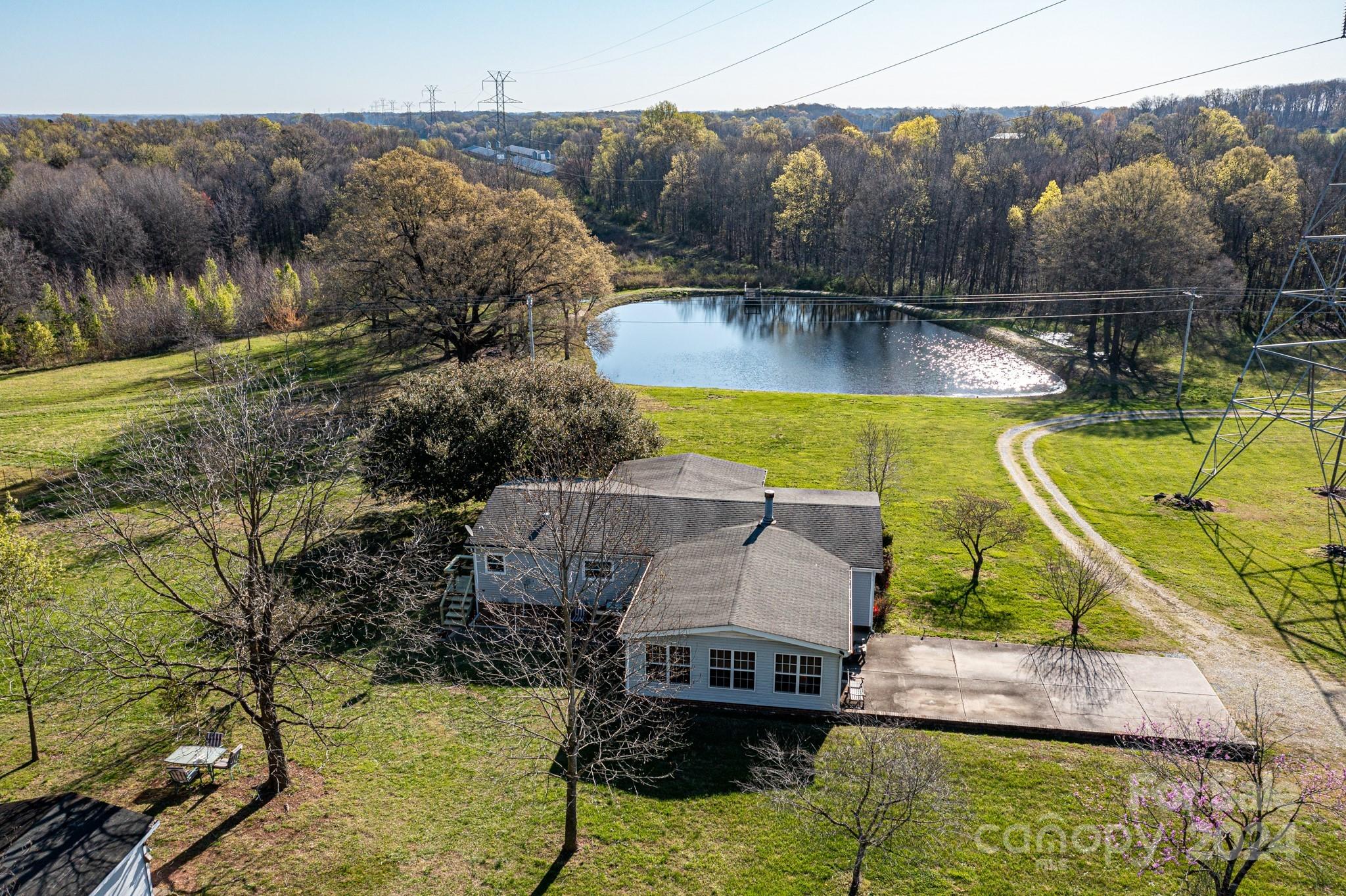 717 Clontz Long Road Monroe, NC 28110 - Photo 8 of 35 a view of a swimming pool with a patio
