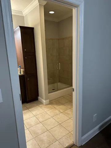 a bathroom with a glass shower door