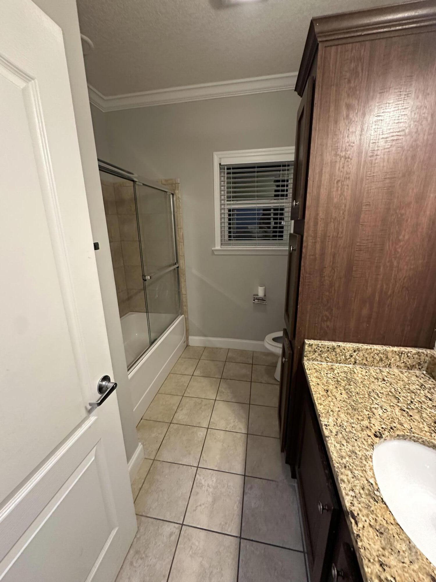 30964 Nathalie Road Big Pine Key, FL 33043 - Photo 8 of 10 a bathroom with a granite countertop sink and mirror