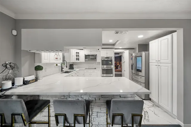 a view of living room with furniture and a chandelier