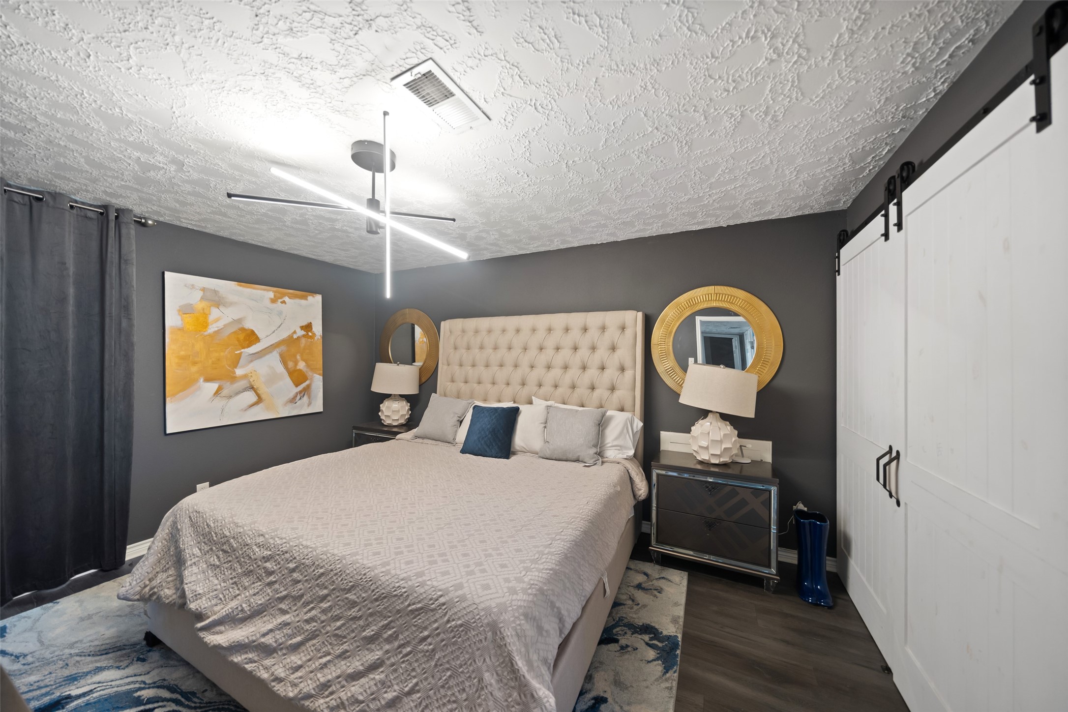 43910 Highway 290 Business Prairie View, TX 77484 - Photo 22 of 45 a bedroom with a bed and a painting on the wall