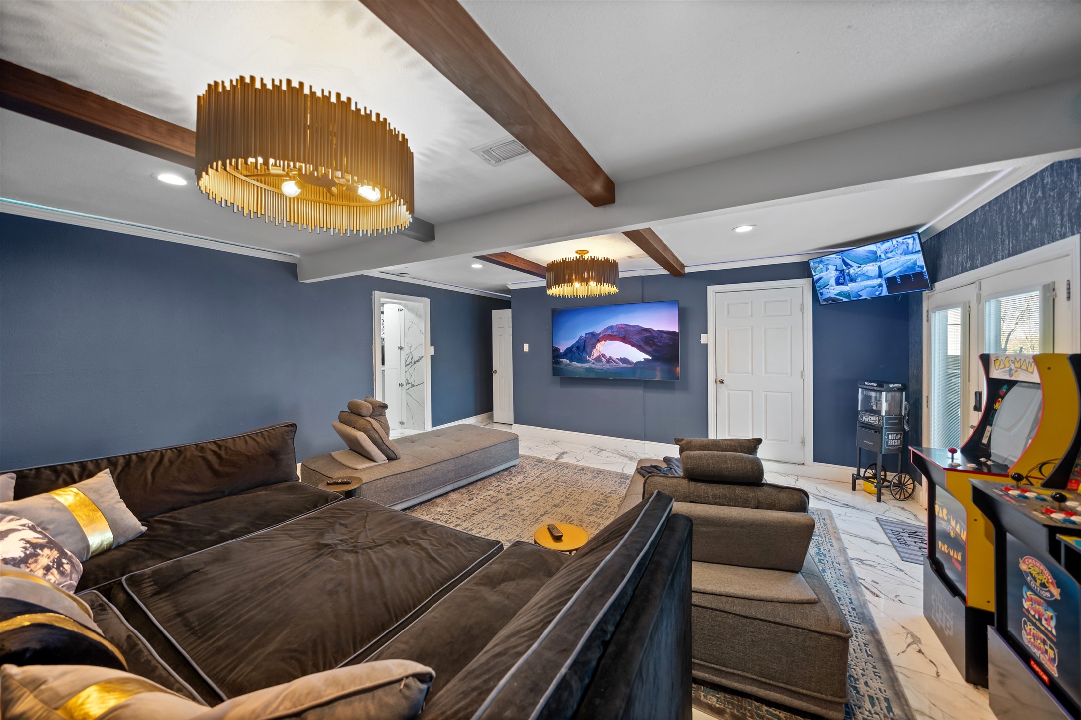 43910 Highway 290 Business Prairie View, TX 77484 - Photo 28 of 49 Large entertainment room with tray ceiling and designer lighting.