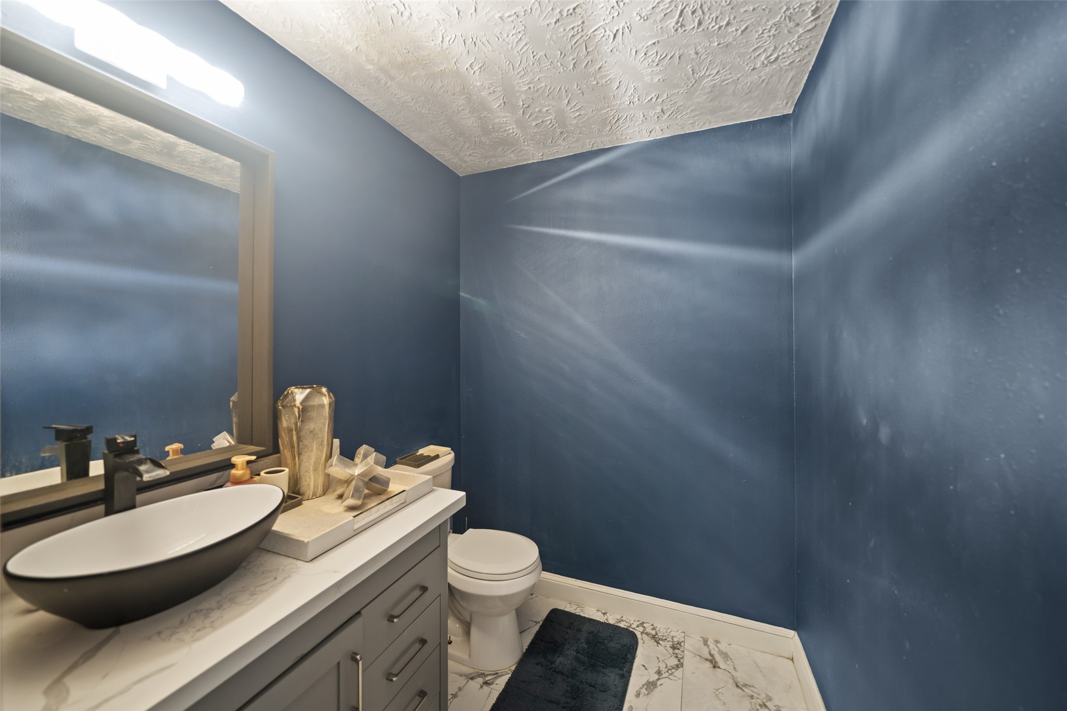 43910 Highway 290 Business Prairie View, TX 77484 - Photo 31 of 45 a bathroom with a sink toilet and a mirror