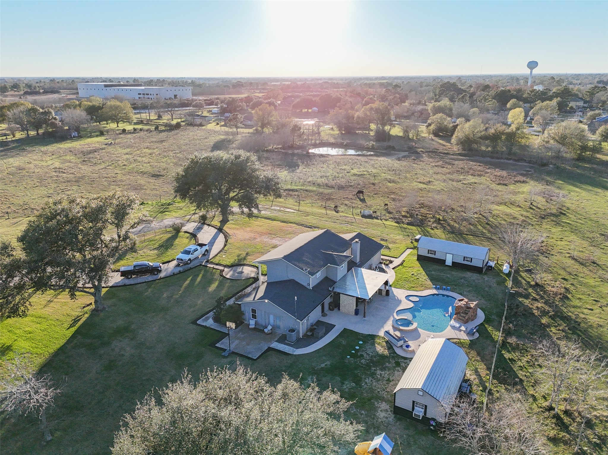 43910 Highway 290 Business Prairie View, TX 77484 - Photo 35 of 49 Expansive aerial showcasing the home, pool, outbuildings, and surrounding pastureland.