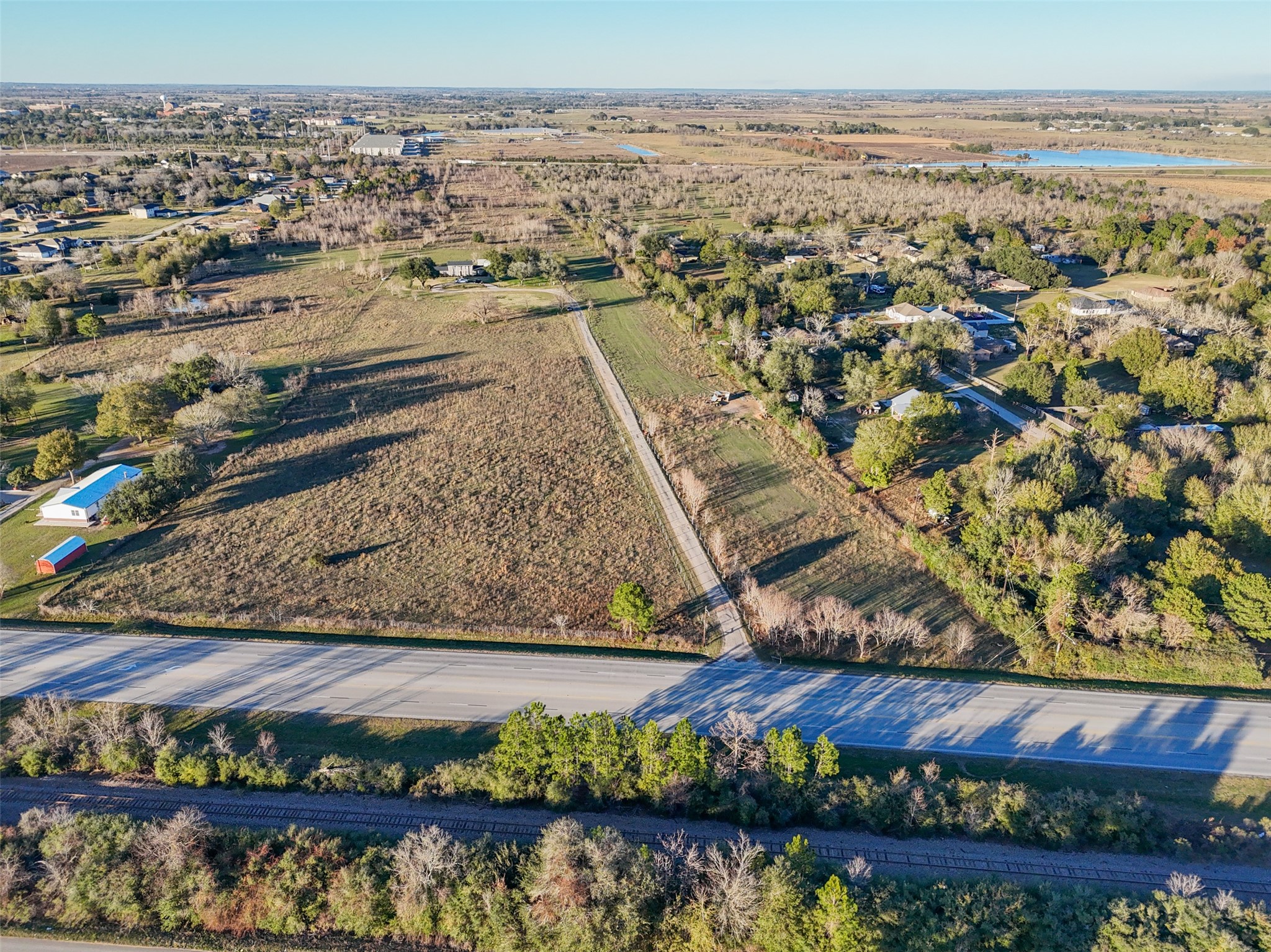 43910 Highway 290 Business Prairie View, TX 77484 - Photo 41 of 49 Bird’s-eye perspective highlighting the property’s frontage, internal access road, and surrounding development.