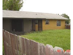 1320 Northeast Creel Palm Bay, FL 32905 - Photo 2 of 2 a view of backyard with wooden fence
