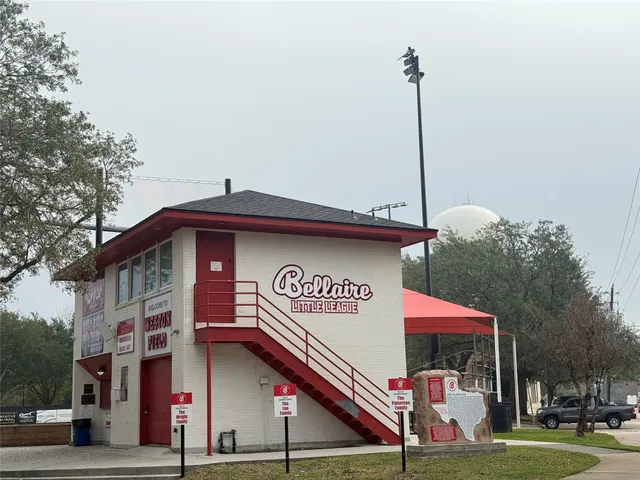 a street sign on a pole on a street