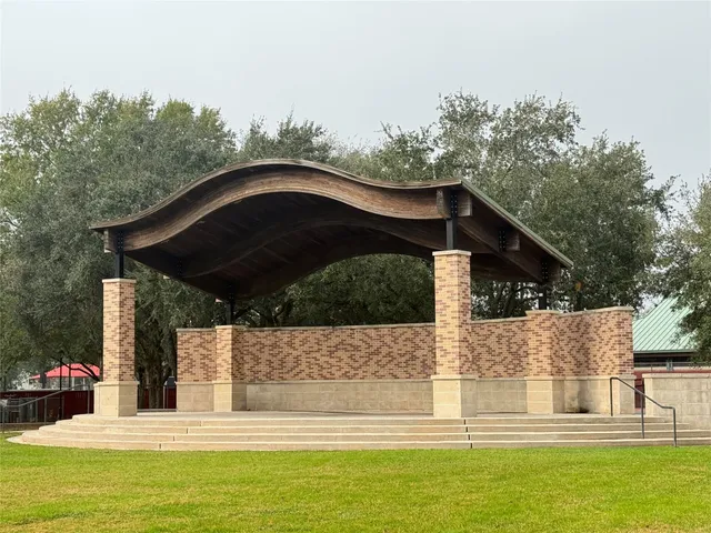 a view of a house with pool and yard