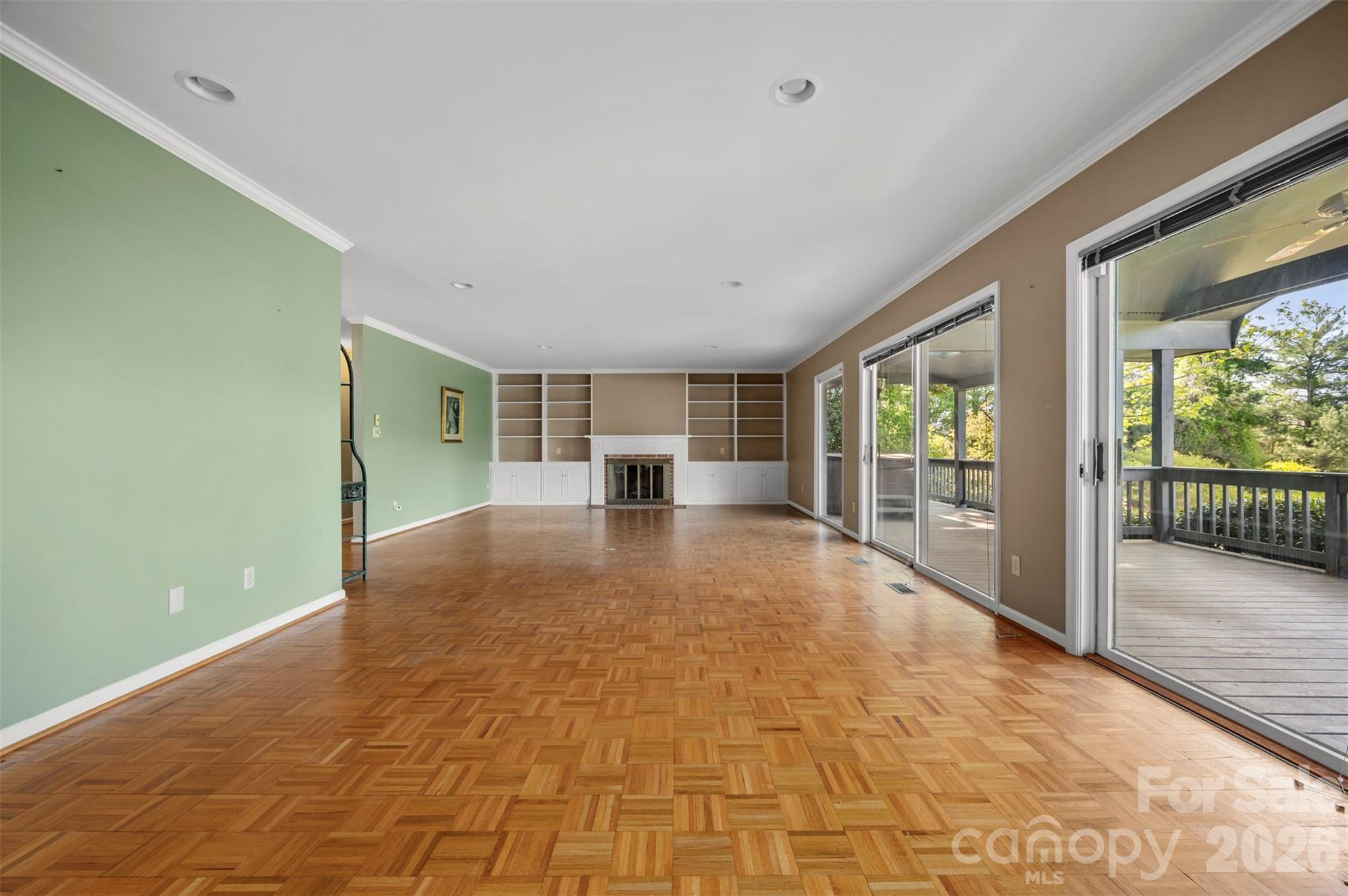176 Fox Run Lane Tryon, NC 28782 - Photo 12 of 44 a view of empty room with wooden floor and fan