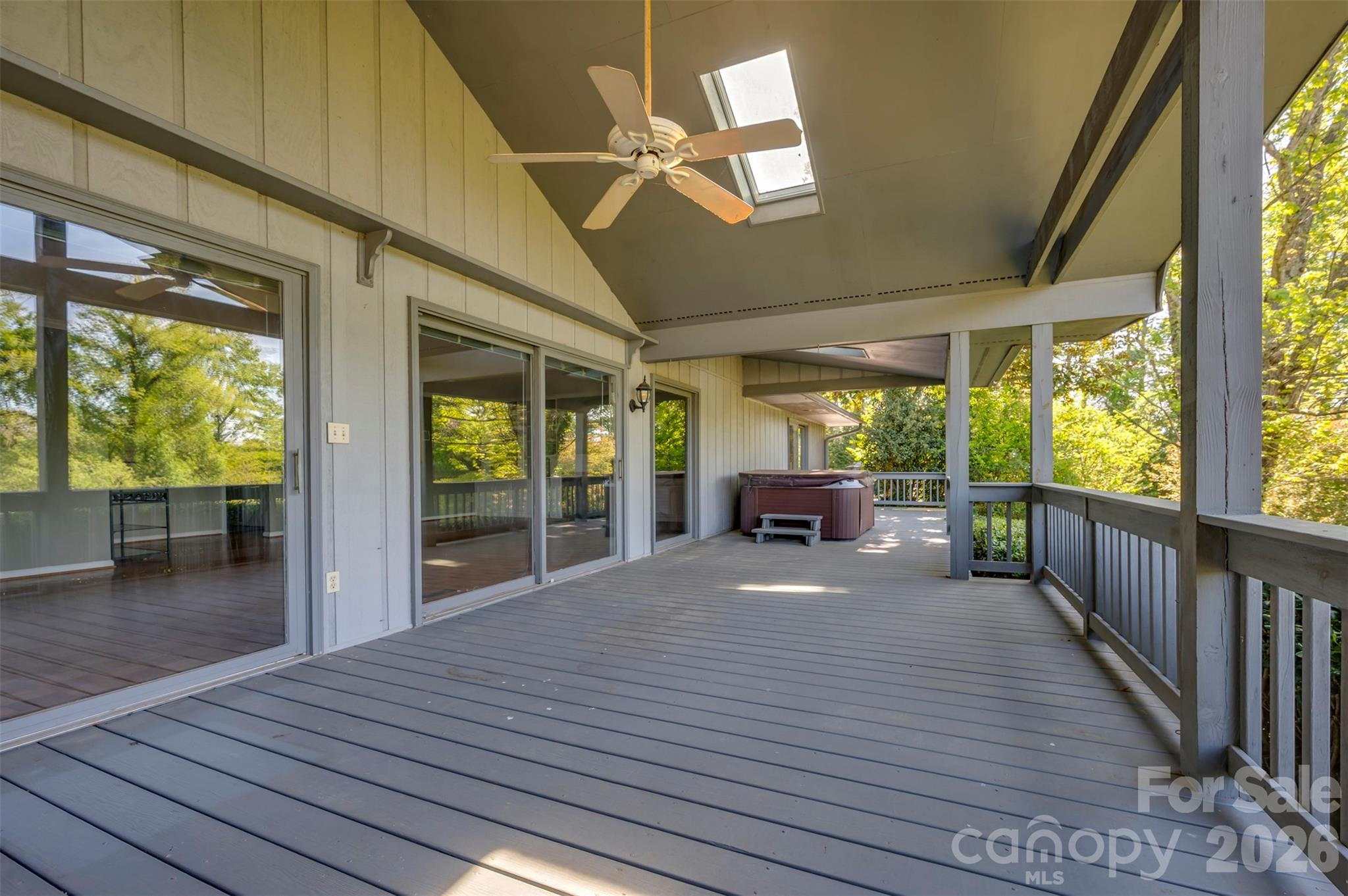 176 Fox Run Lane Tryon, NC 28782 - Photo 14 of 44 a view of a patio with table and chairs potted plants with wooden floor