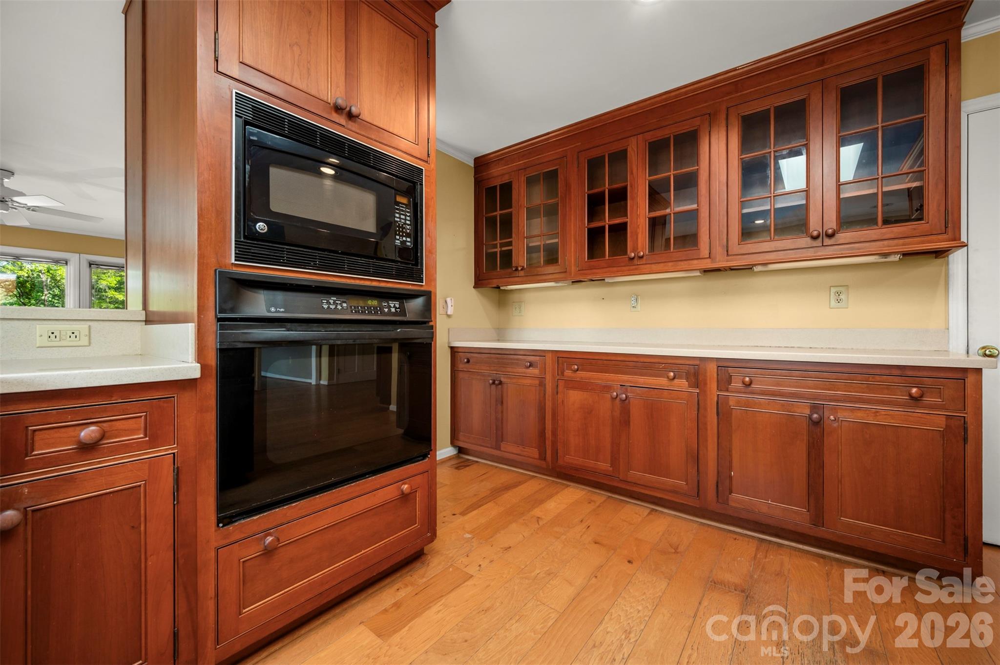176 Fox Run Lane Tryon, NC 28782 - Photo 16 of 44 a kitchen with stainless steel appliances granite countertop a stove microwave and cabinets