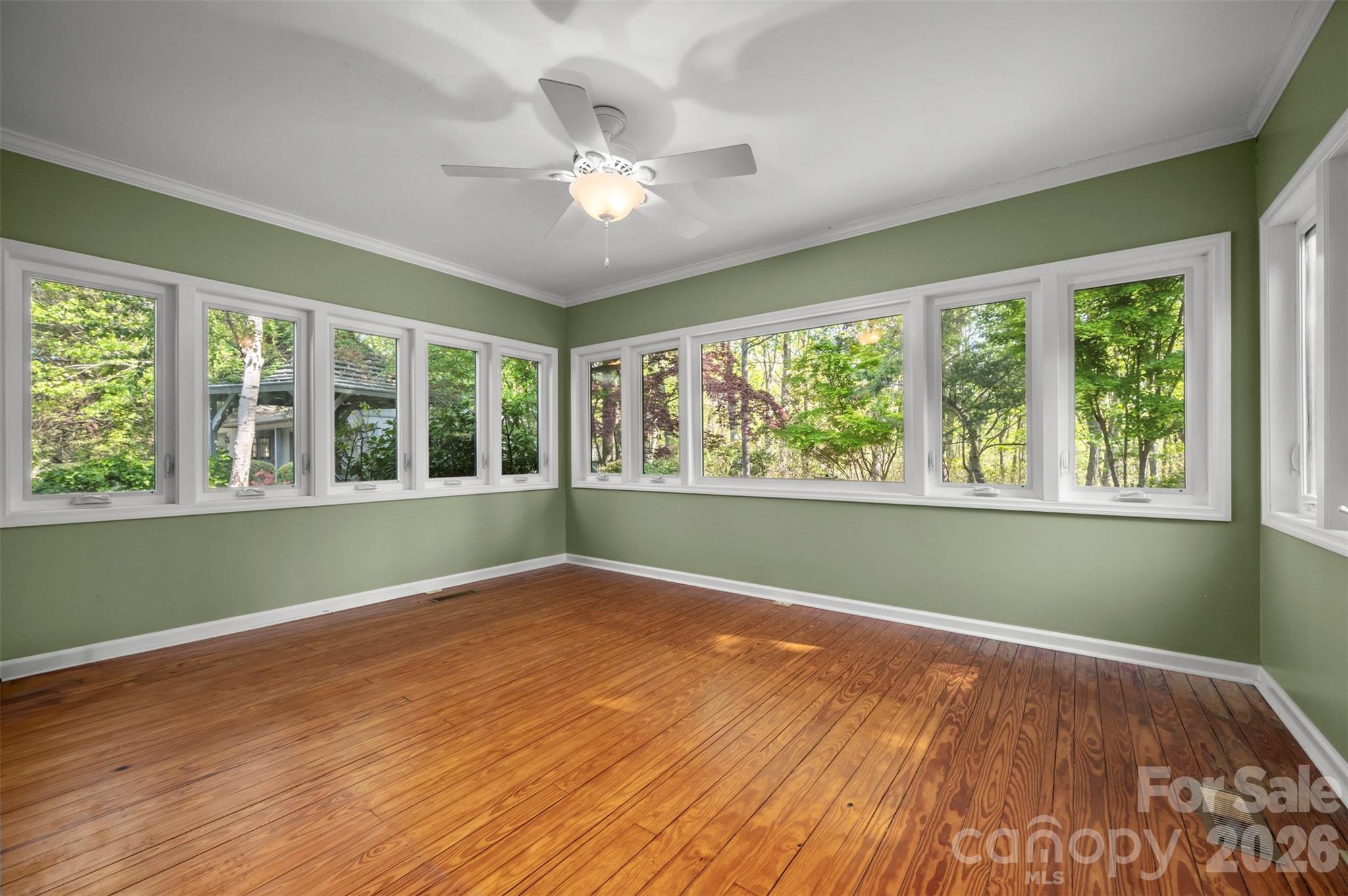 176 Fox Run Lane Tryon, NC 28782 - Photo 21 of 44 a view of an empty room with wooden floor and a window