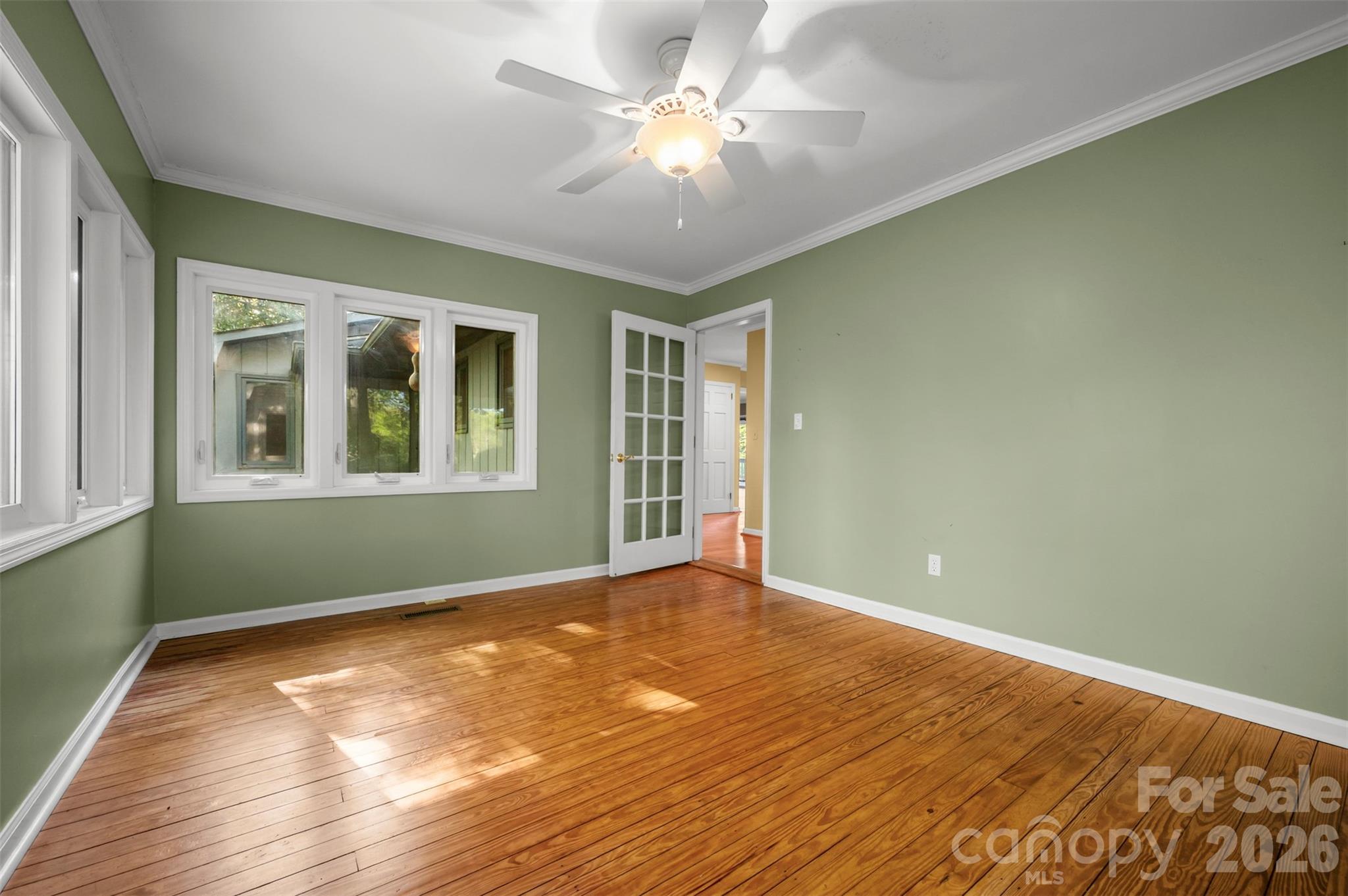 176 Fox Run Lane Tryon, NC 28782 - Photo 22 of 44 a view of an empty room with window and chandelier fan