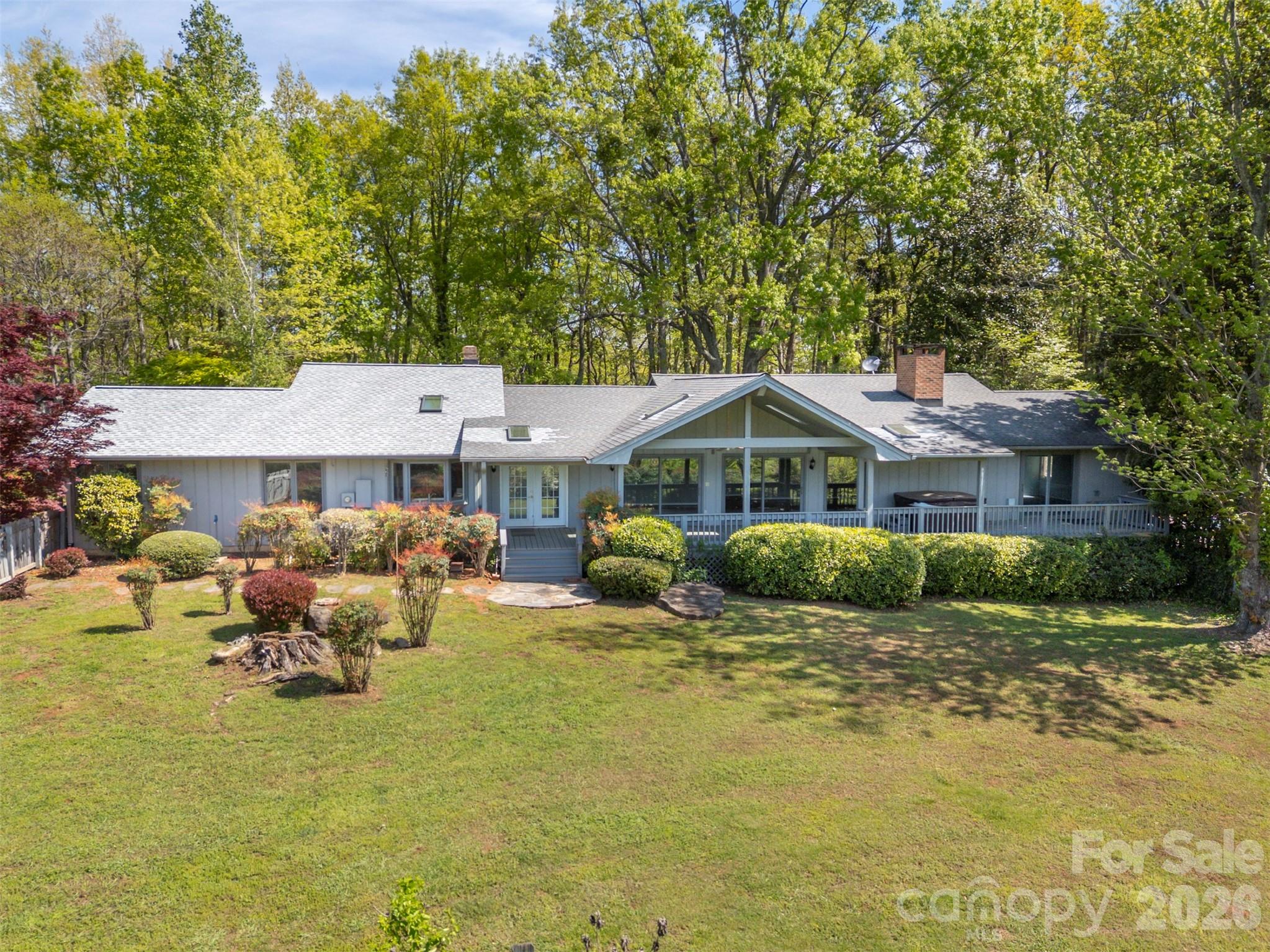 176 Fox Run Lane Tryon, NC 28782 - Photo 9 of 44 a front view of a house with a yard