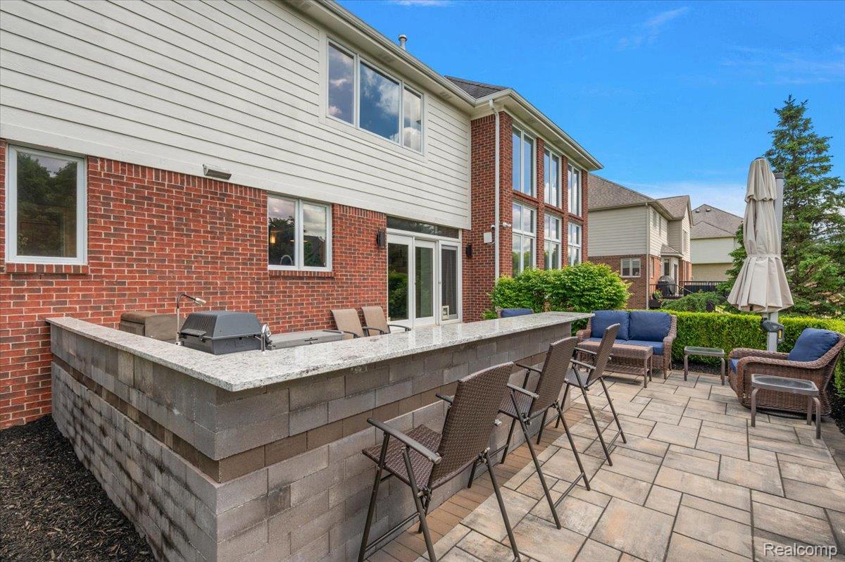 1422 Galena Rochester, MI 48306 - Photo 65 of 73 Outdoor entertainment area featuring a built-in bar with a stone countertop and an integrated grill