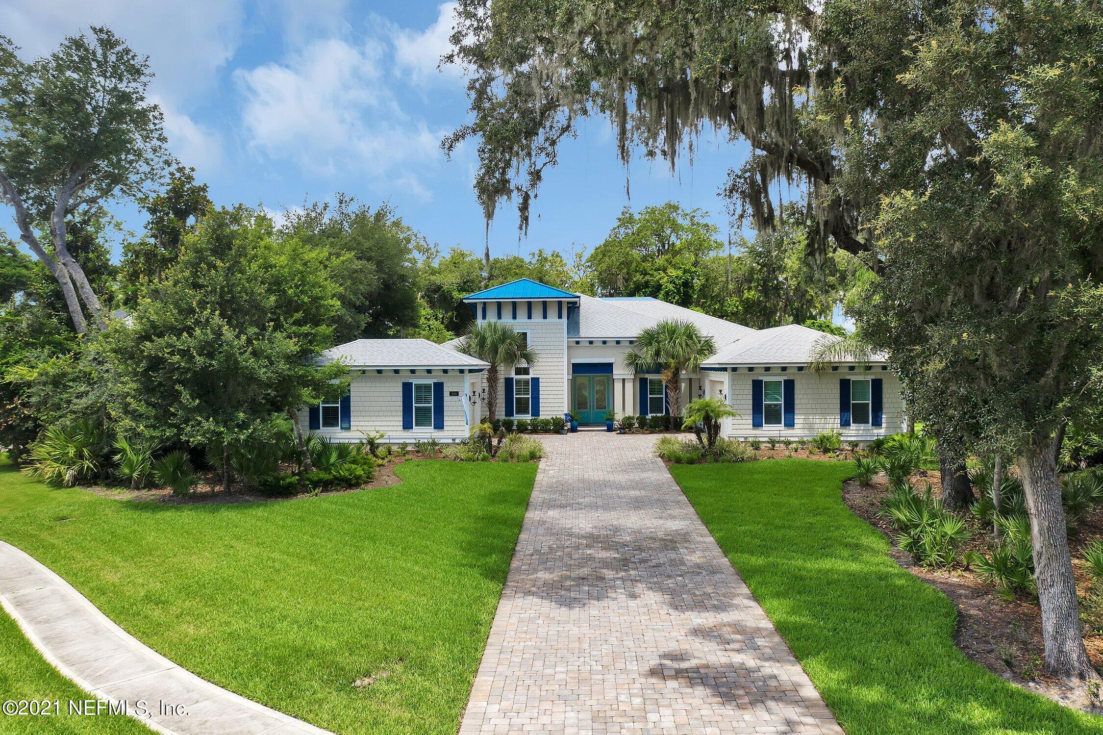 496 Costa Del Sol Drive St. Augustine, FL 32095 - Photo 102 of 111 a front view of a house with a yard