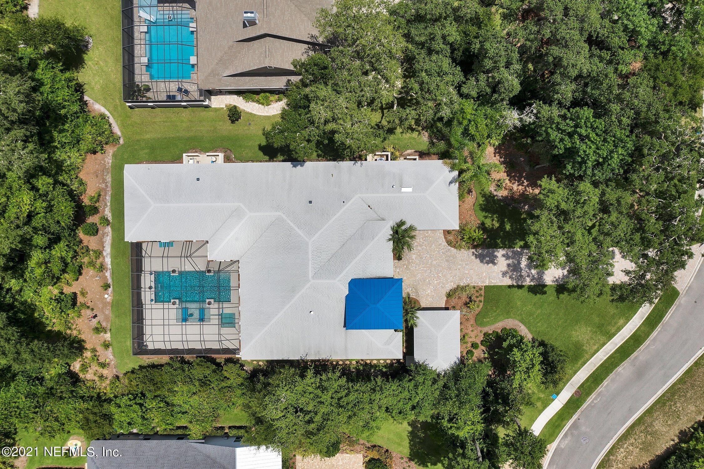 496 Costa Del Sol Drive St. Augustine, FL 32095 - Photo 104 of 111 an aerial view of a house with outdoor space and lake view