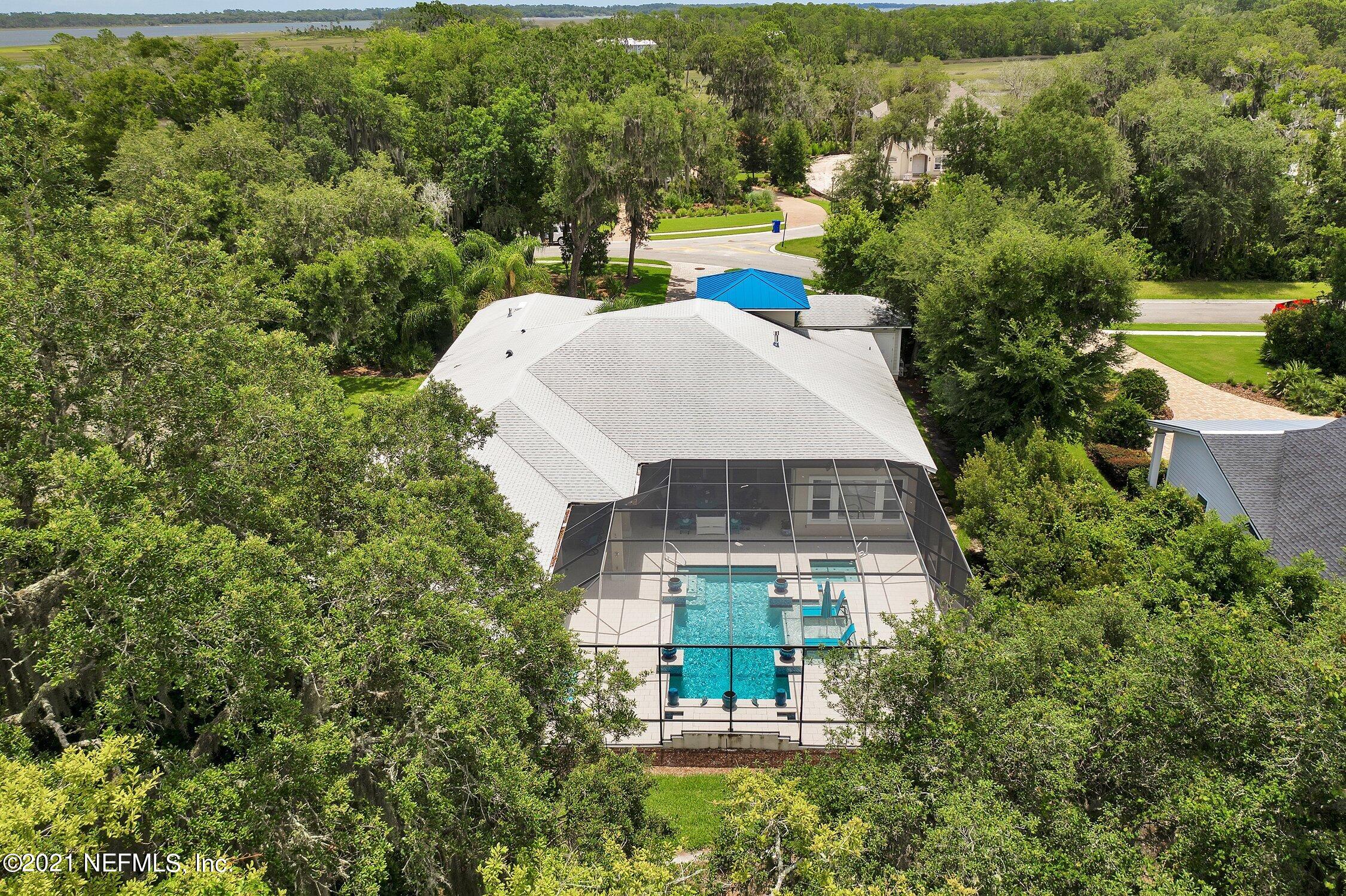 496 Costa Del Sol Drive St. Augustine, FL 32095 - Photo 105 of 111 an aerial view of a house with a garden