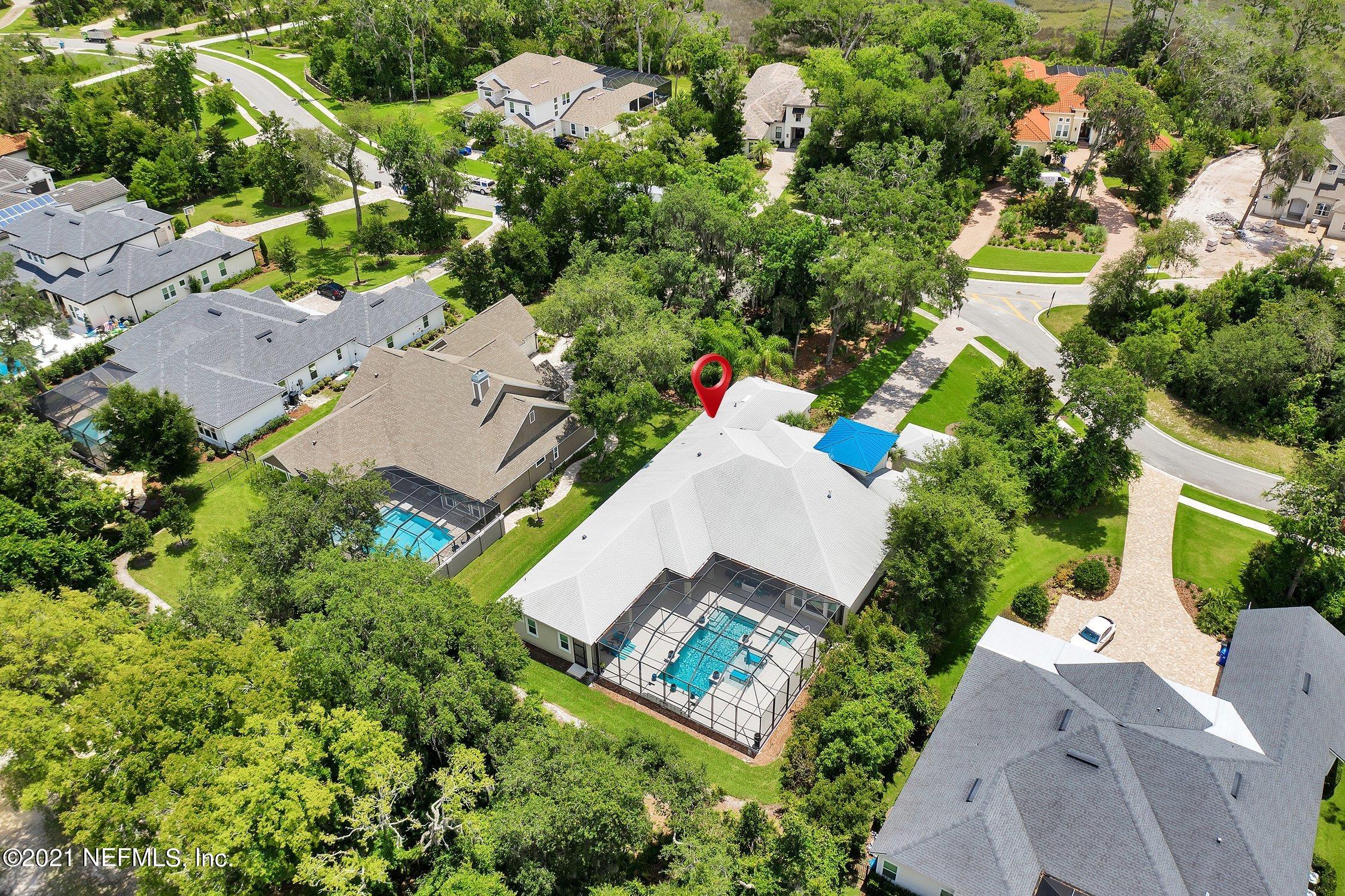 496 Costa Del Sol Drive St. Augustine, FL 32095 - Photo 109 of 111 an aerial view of a house with a yard and outdoor seating