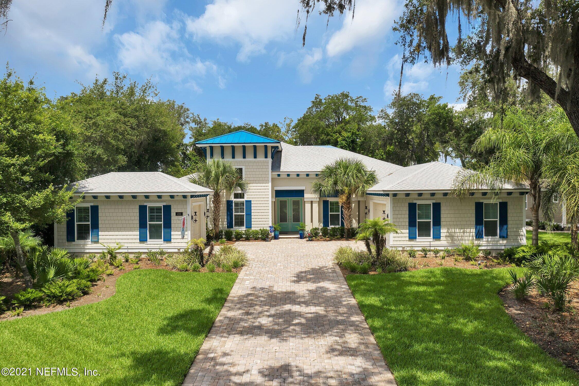 496 Costa Del Sol Drive St. Augustine, FL 32095 - Photo 2 of 111 a front view of a house with a yard