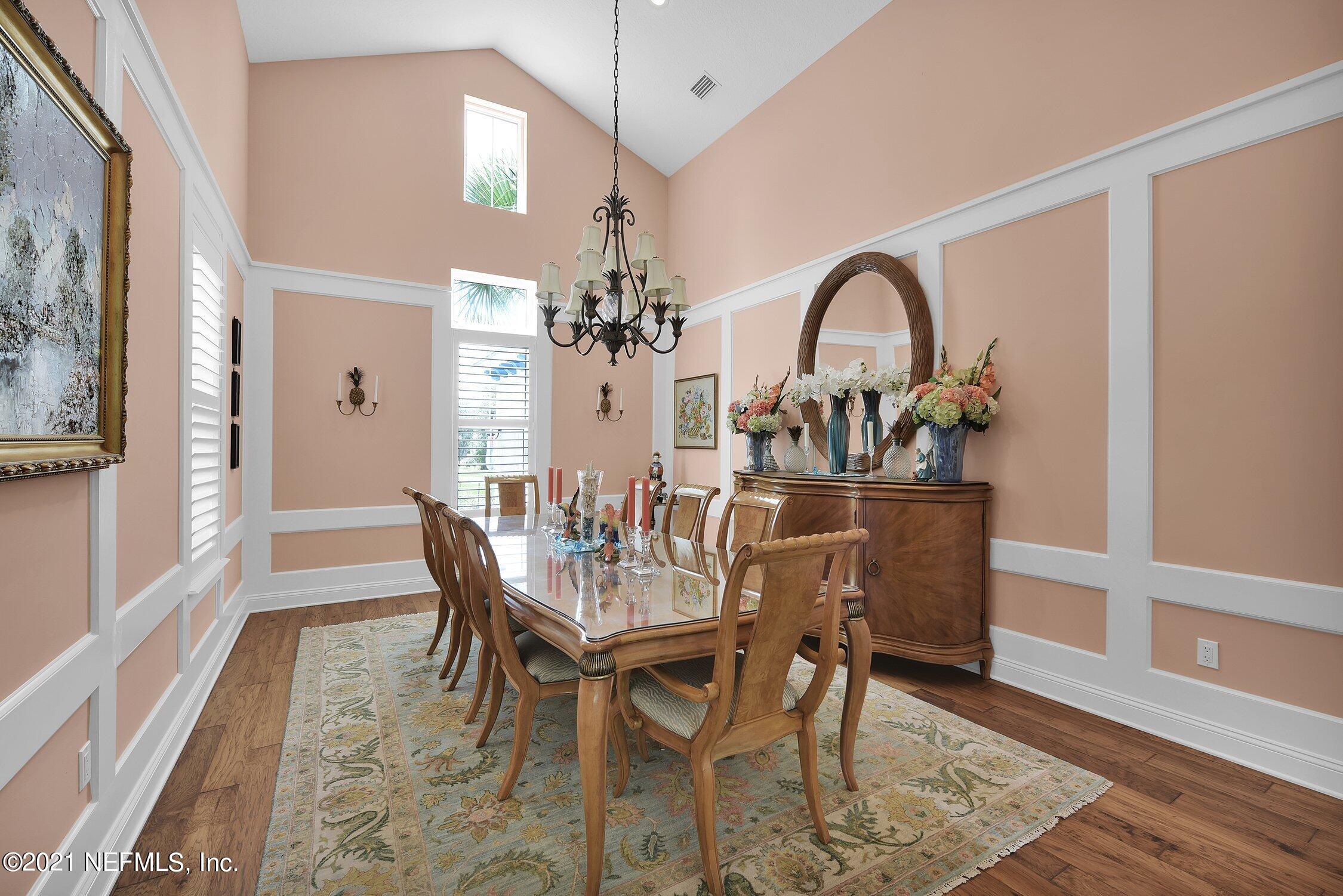 496 Costa Del Sol Drive St. Augustine, FL 32095 - Photo 21 of 111 a view of a dining room with furniture and wooden floor