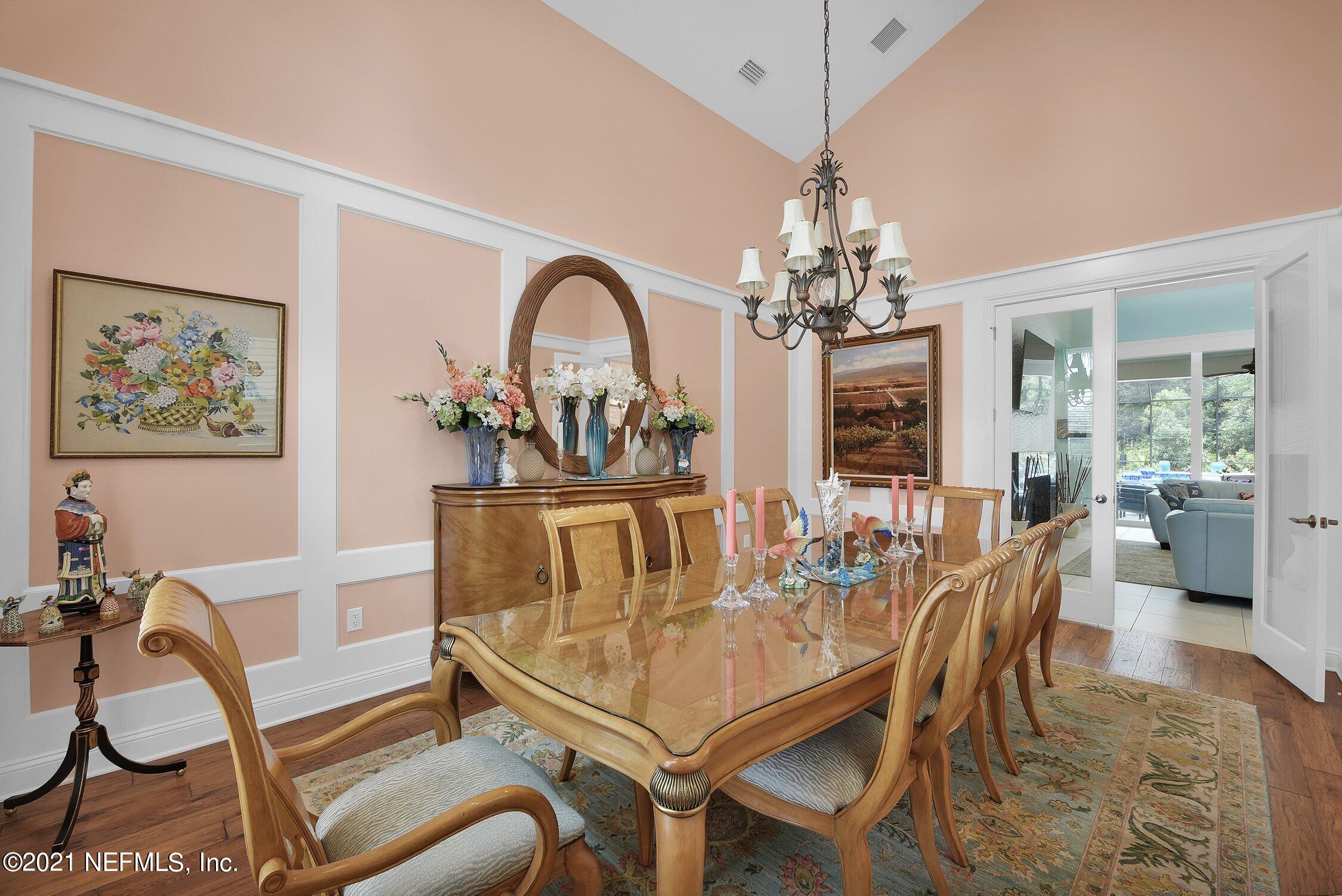 496 Costa Del Sol Drive St. Augustine, FL 32095 - Photo 22 of 111 a dining room with furniture a livingroom and chandelier