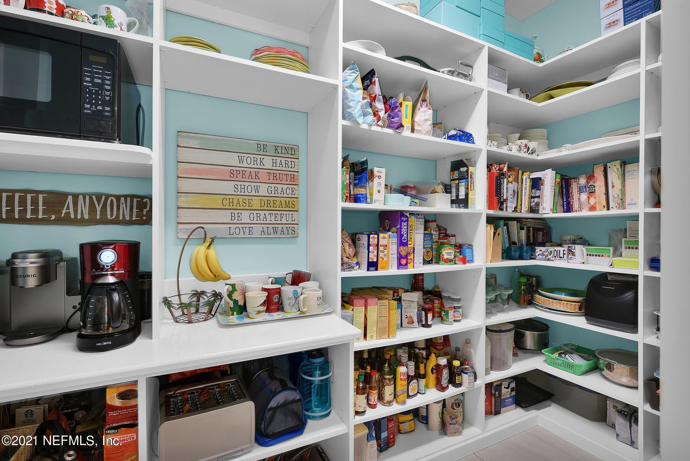 496 Costa Del Sol Drive St. Augustine, FL 32095 - Photo 32 of 111 a room with furniture and a book shelf