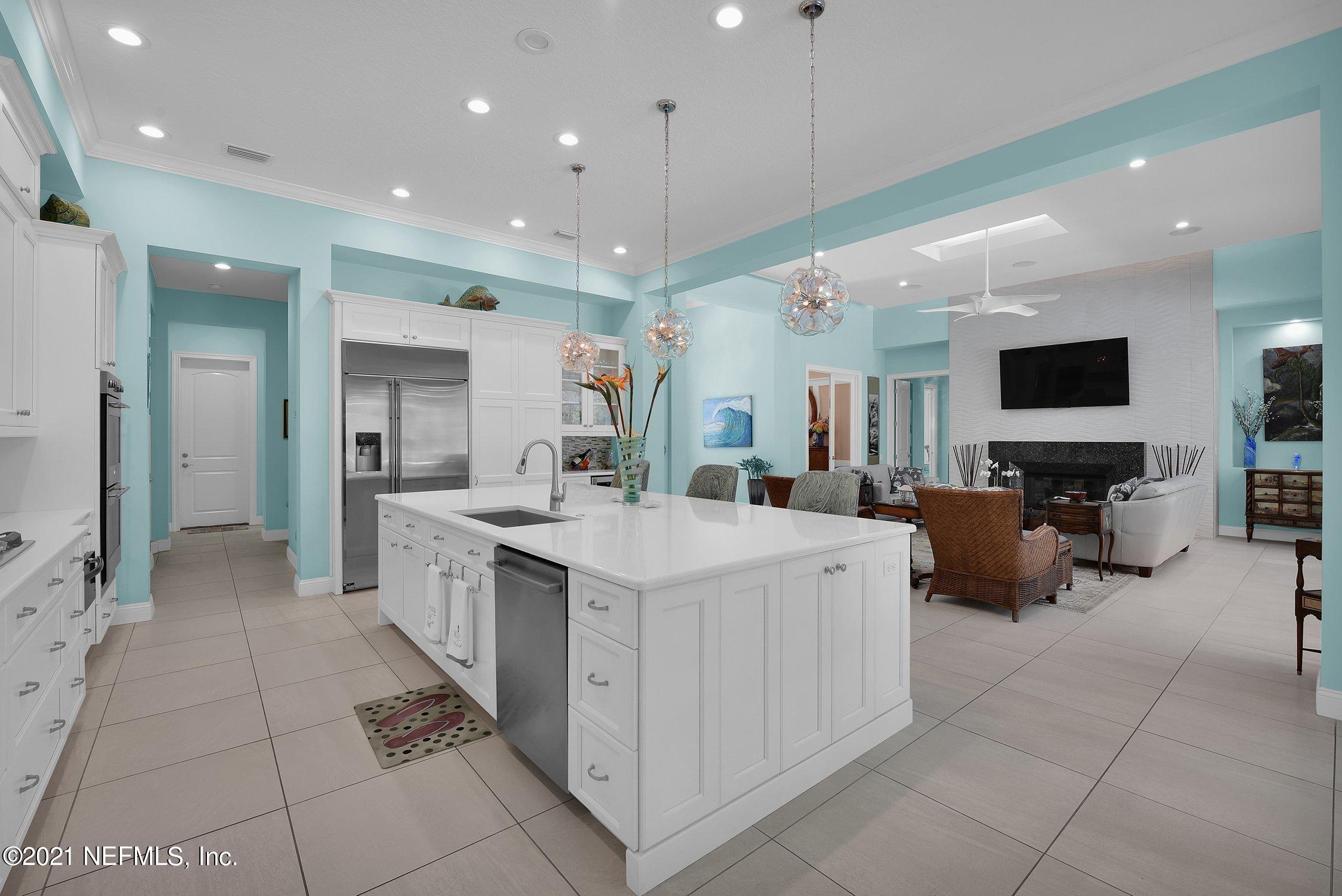 496 Costa Del Sol Drive St. Augustine, FL 32095 - Photo 35 of 111 a large white kitchen with a large window and stainless steel appliances