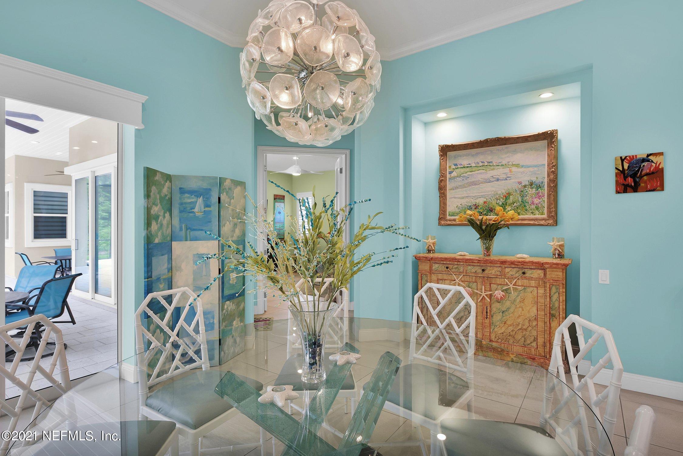 496 Costa Del Sol Drive St. Augustine, FL 32095 - Photo 38 of 111 a view of a dining room with furniture and wooden floor