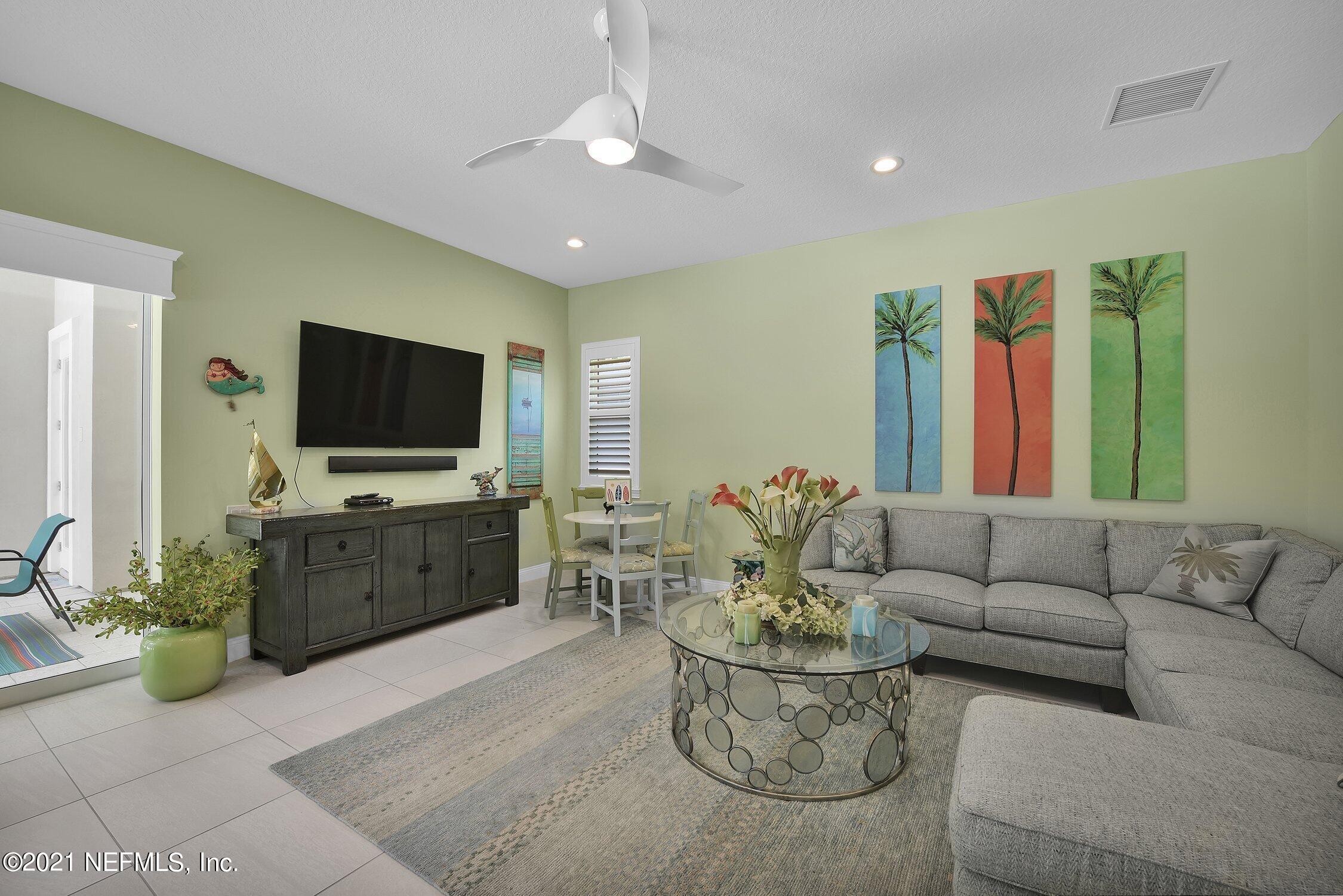 496 Costa Del Sol Drive St. Augustine, FL 32095 - Photo 63 of 111 a living room with furniture and a flat screen tv