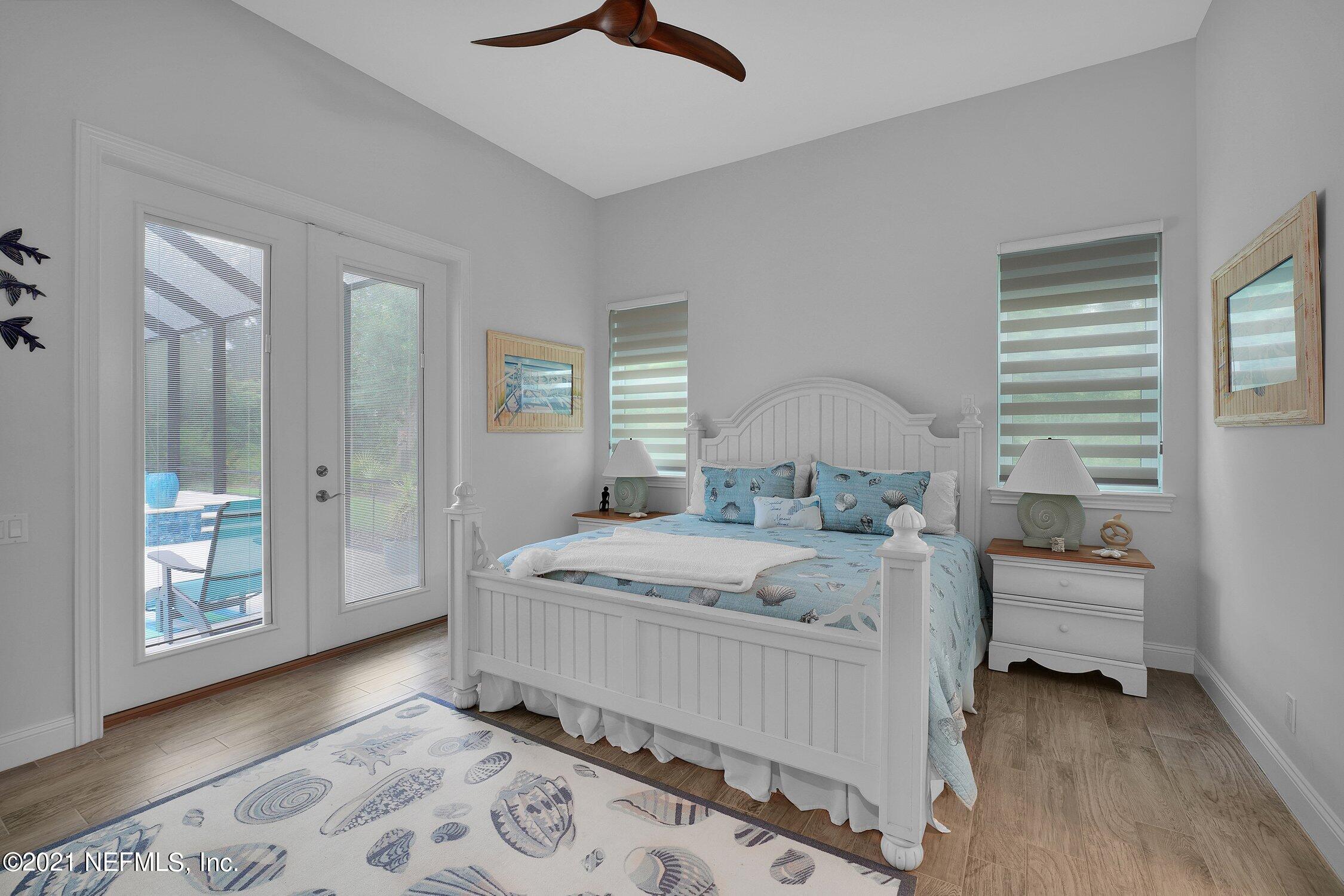 496 Costa Del Sol Drive St. Augustine, FL 32095 - Photo 69 of 111 a bedroom with a bed and a window