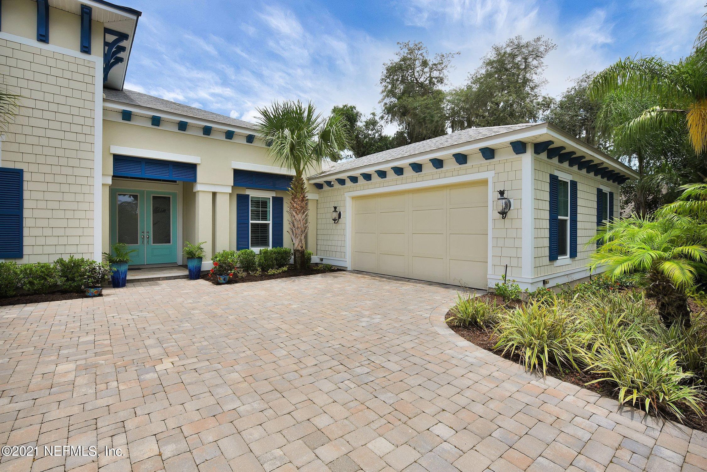 496 Costa Del Sol Drive St. Augustine, FL 32095 - Photo 7 of 111 a front view of a house with a yard and garage