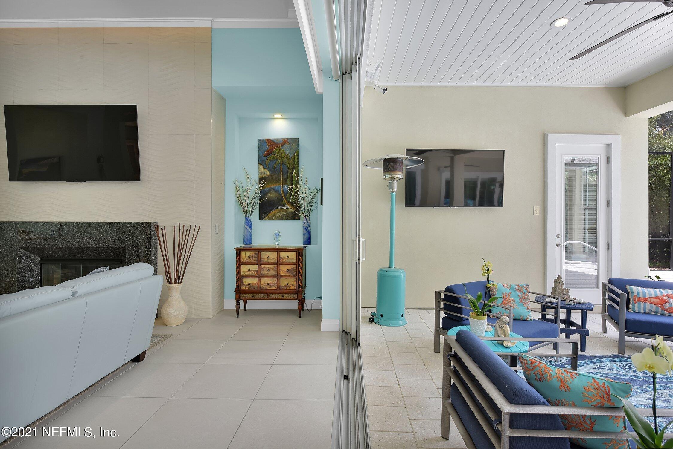 496 Costa Del Sol Drive St. Augustine, FL 32095 - Photo 76 of 111 a living room with furniture and a flat screen tv