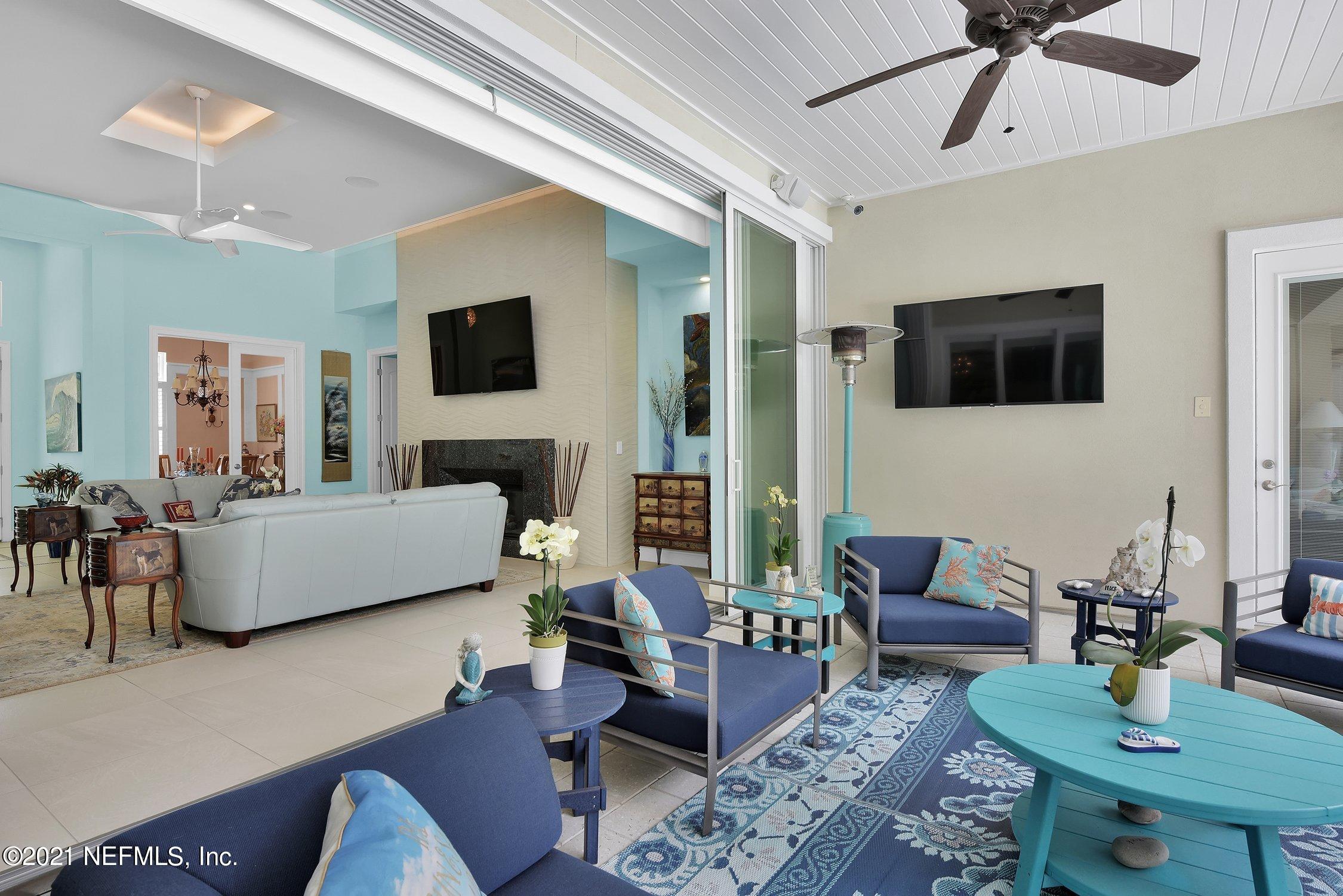 496 Costa Del Sol Drive St. Augustine, FL 32095 - Photo 77 of 111 a living room with furniture and a flat screen tv