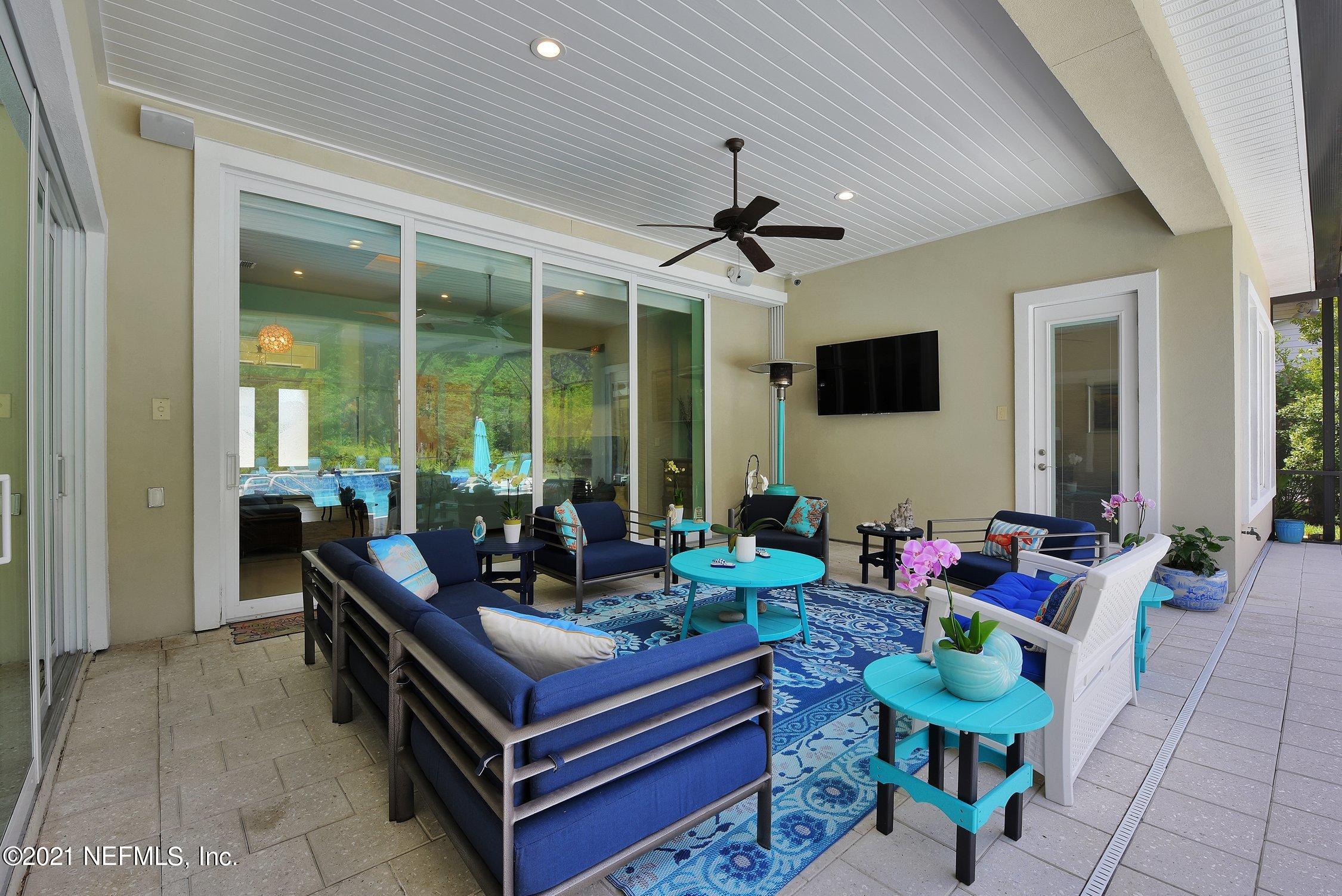 496 Costa Del Sol Drive St. Augustine, FL 32095 - Photo 80 of 111 a living room with patio furniture and a large window