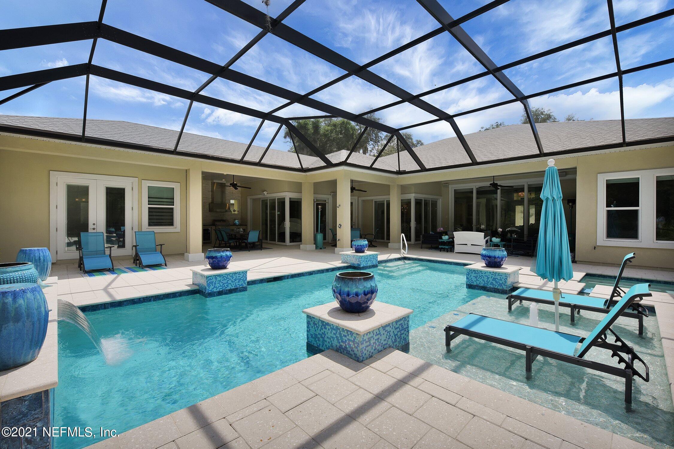 496 Costa Del Sol Drive St. Augustine, FL 32095 - Photo 92 of 111 a view of a house with garden and patio